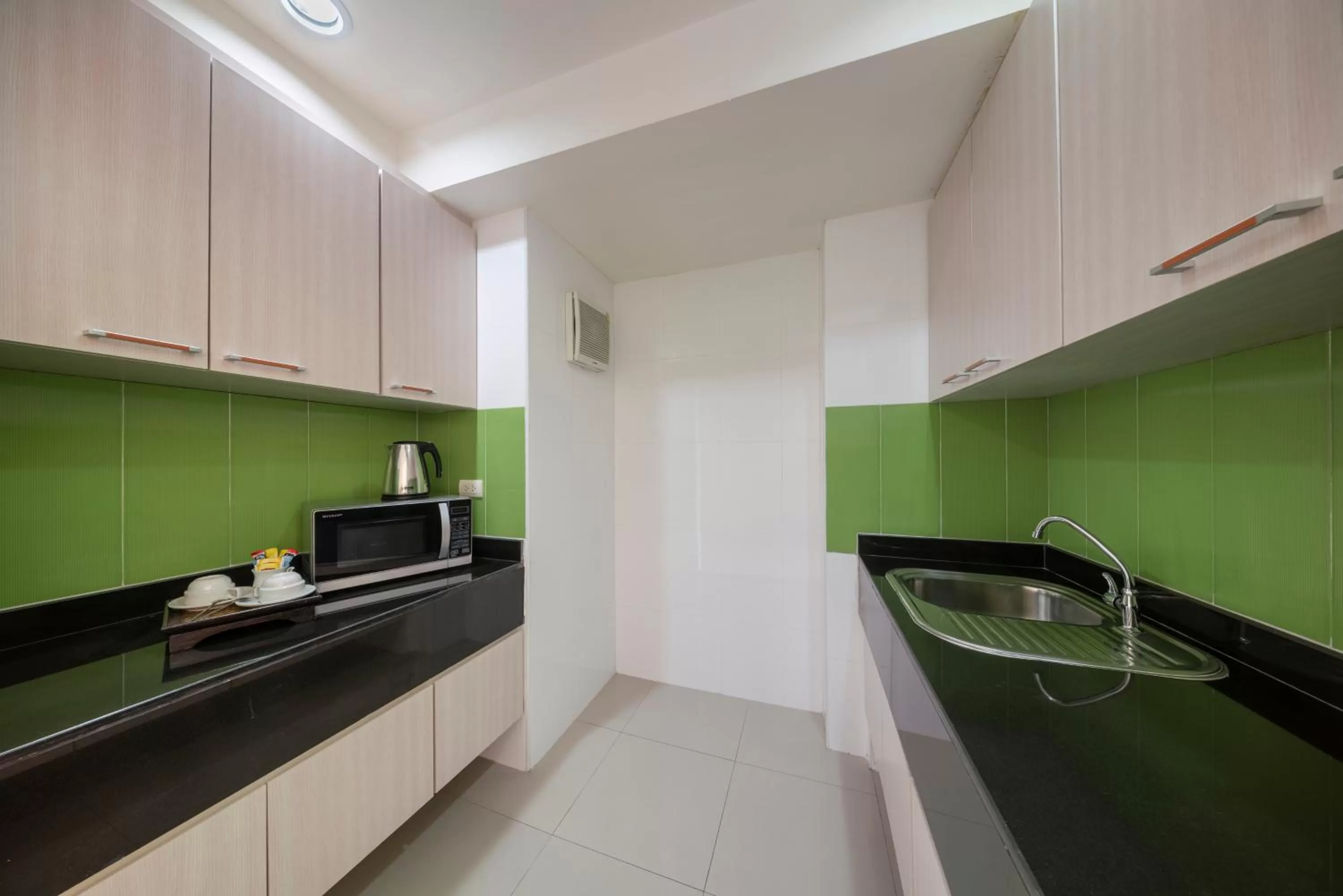 Kitchen or kitchenette in At 115 Hotel By Rompo