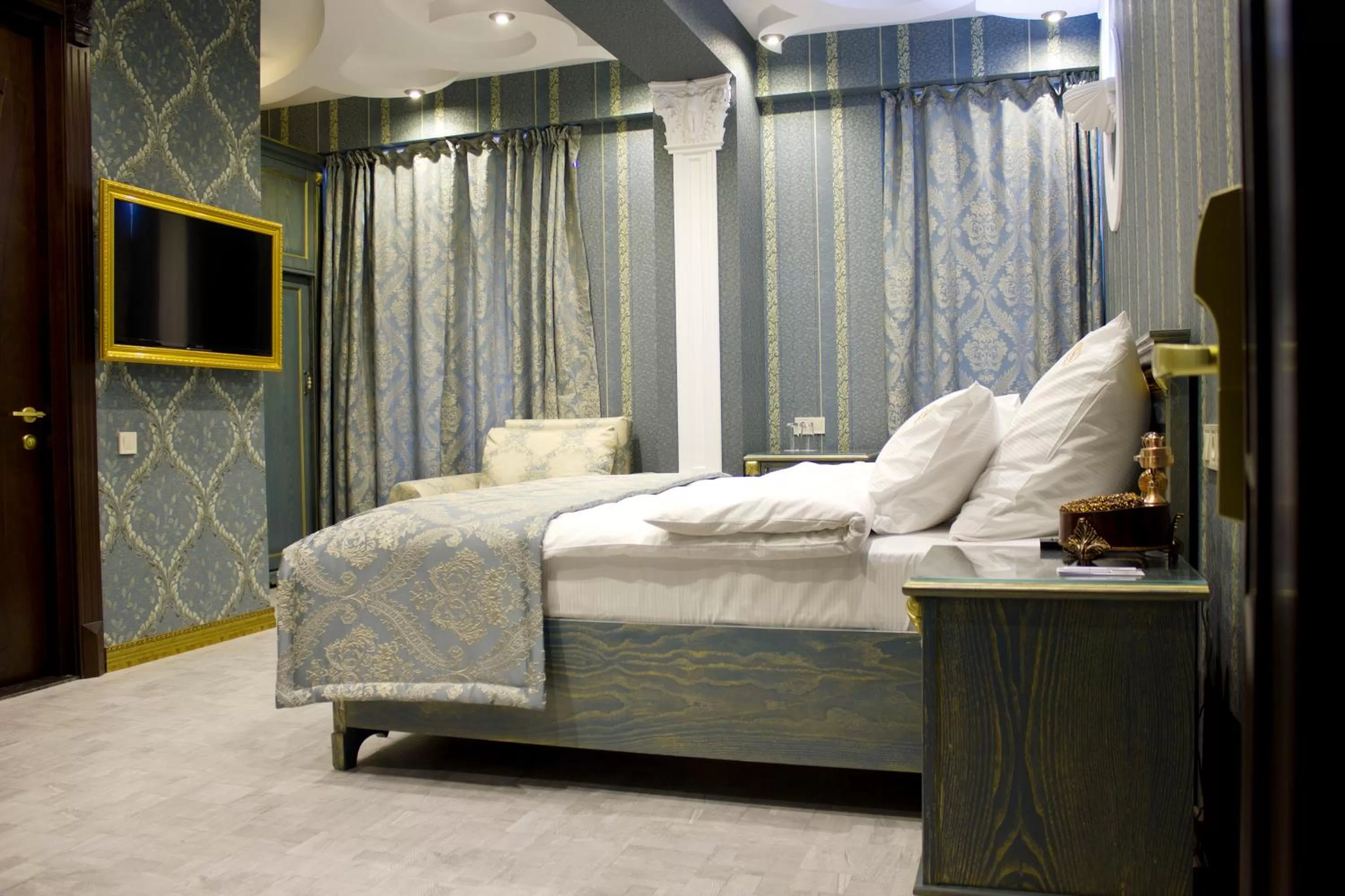 Photo of the whole room, Bed in Neapol Boutique Hotel