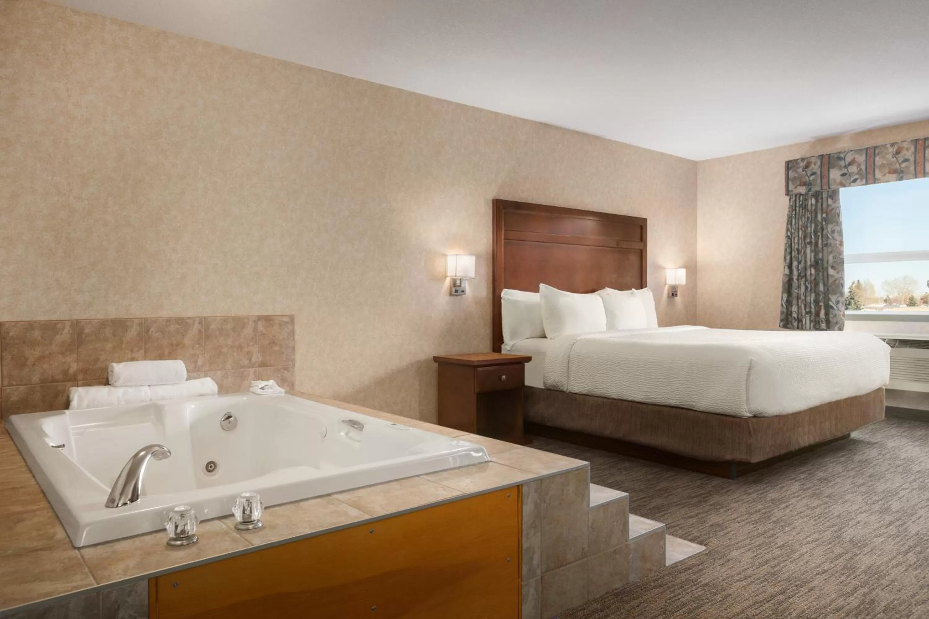 Bed in Days Inn & Suites by Wyndham Brooks