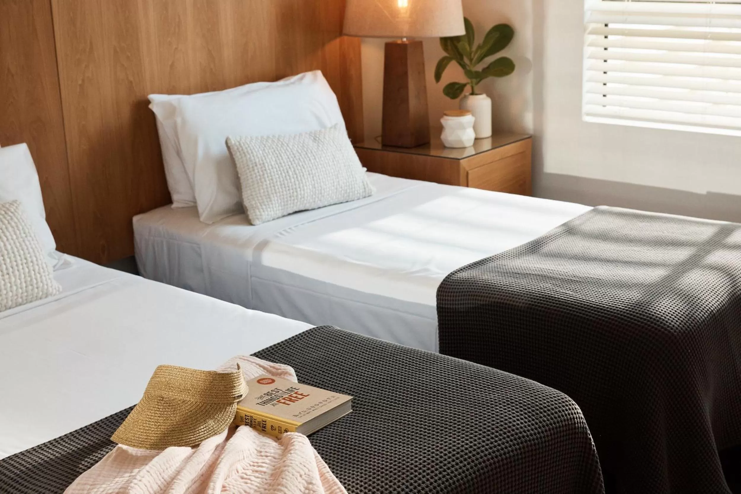 Bed in Sea Change Beachfront Apartments