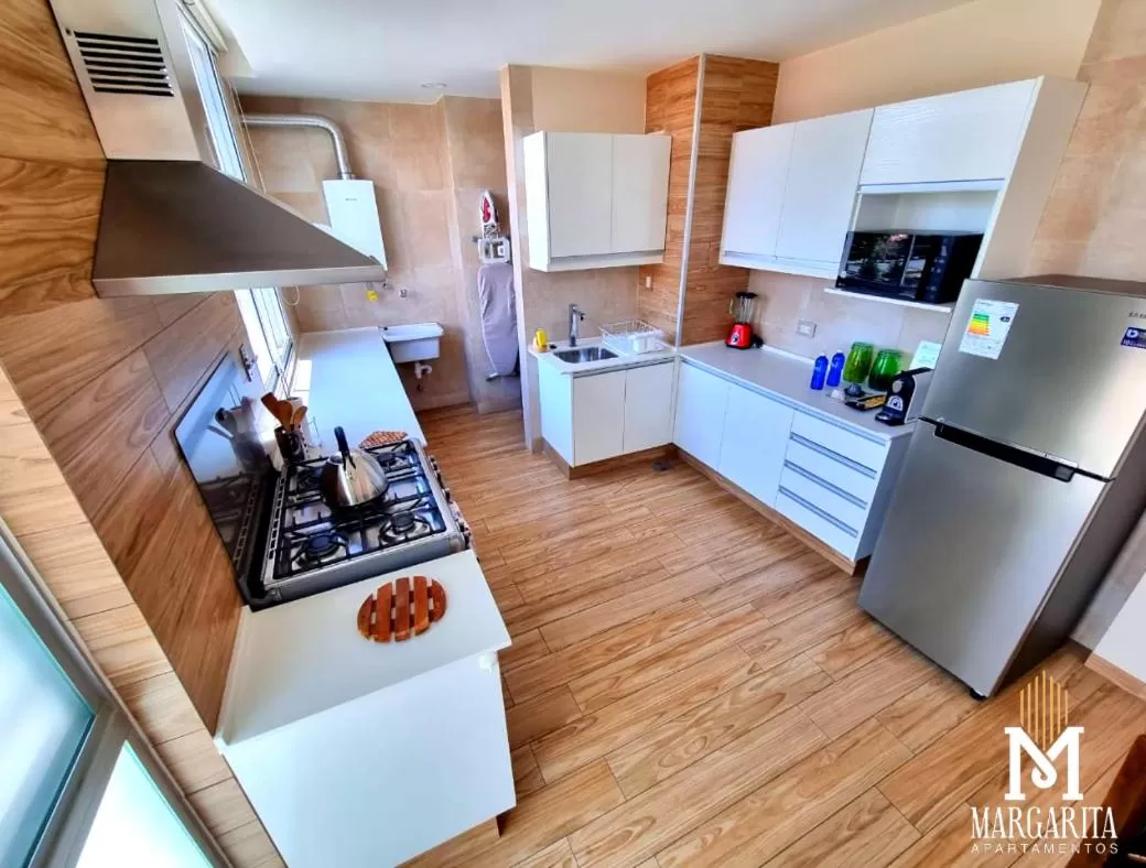 Kitchen or kitchenette in Margarita Apartamentos