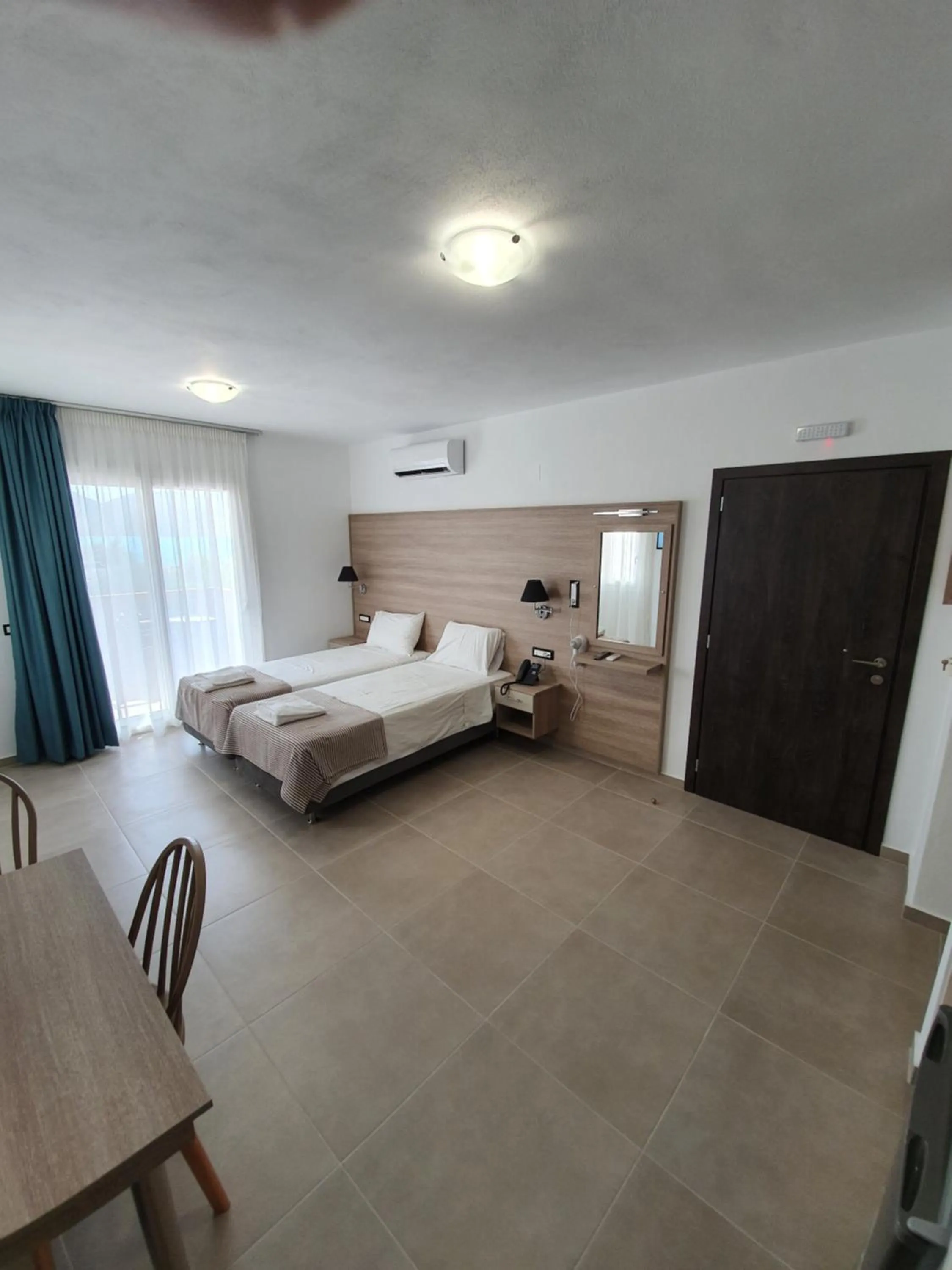 Bed in Elounda Sunrise Apartments