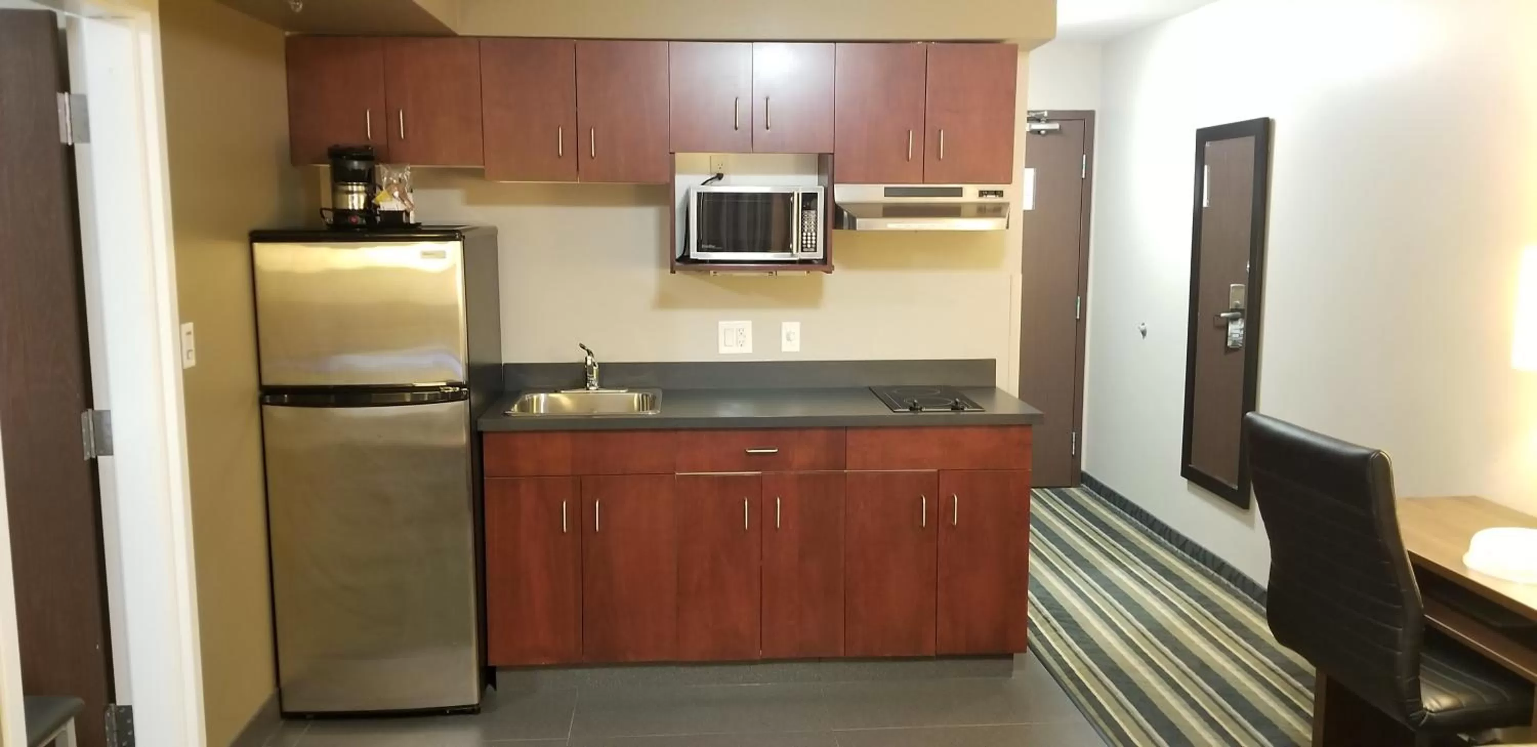 Kitchen or kitchenette in Super 8 by Wyndham Brandon MB