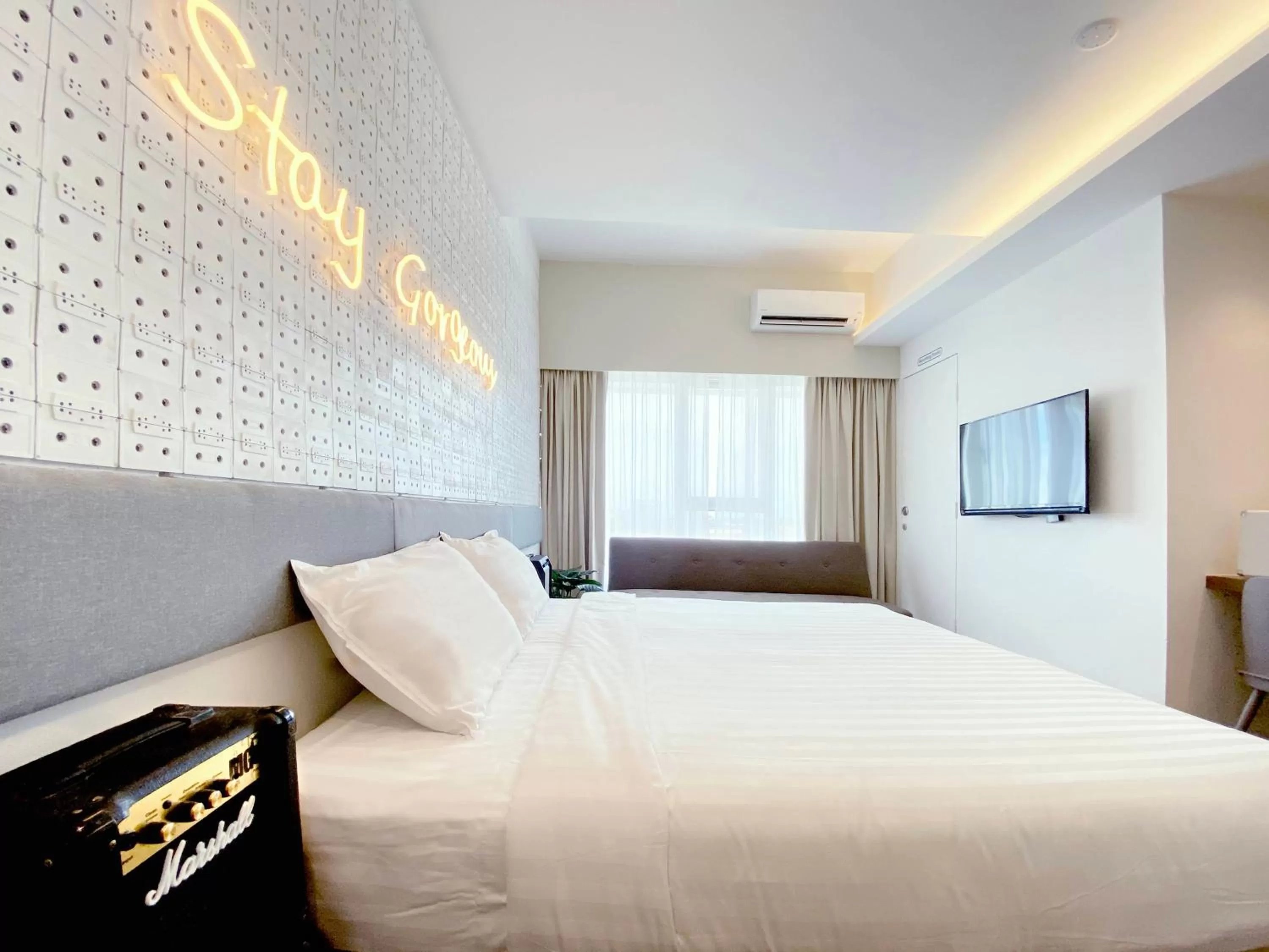 Bed in The Atelier Boutique Hotel