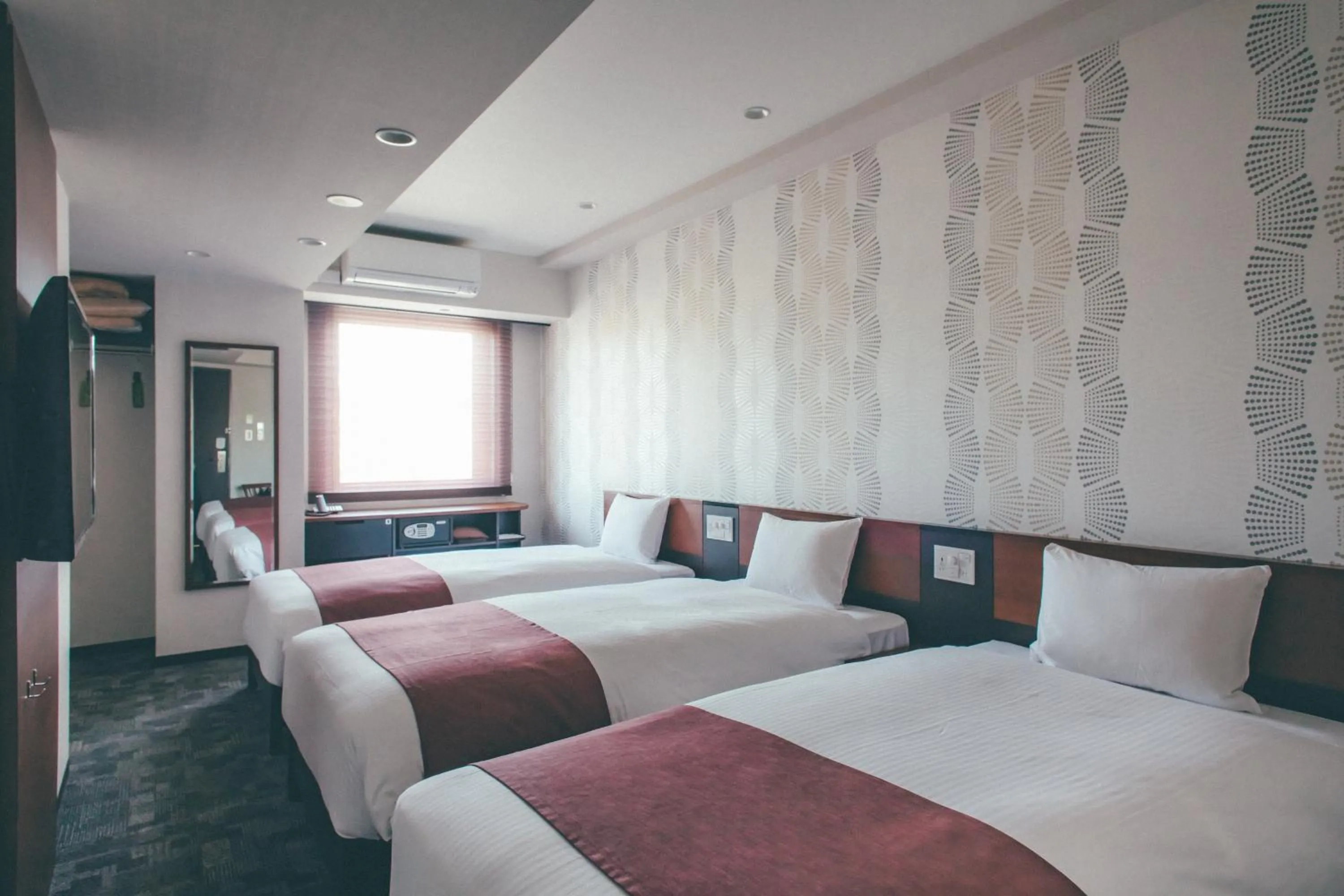 Bed in Hotel Kuretakeso Takayama Ekimae