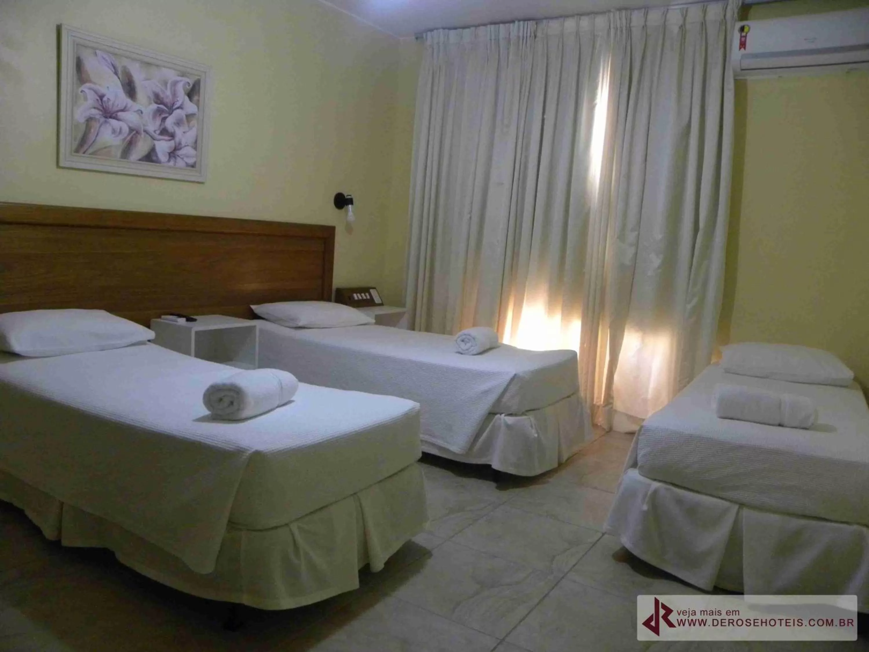 Bed in De Rose Palace Hotel