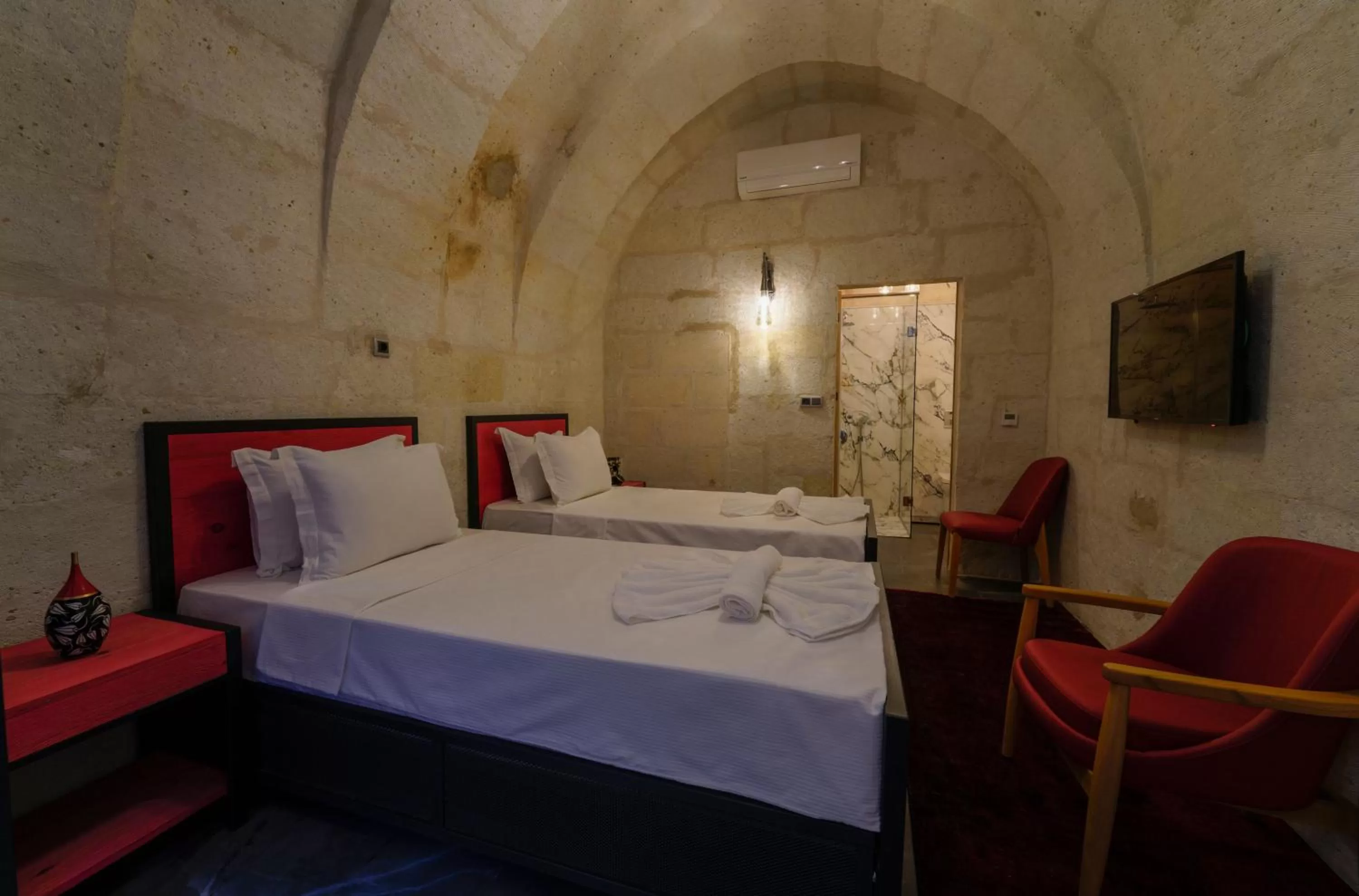 Bed in The Niche Cave Hotel