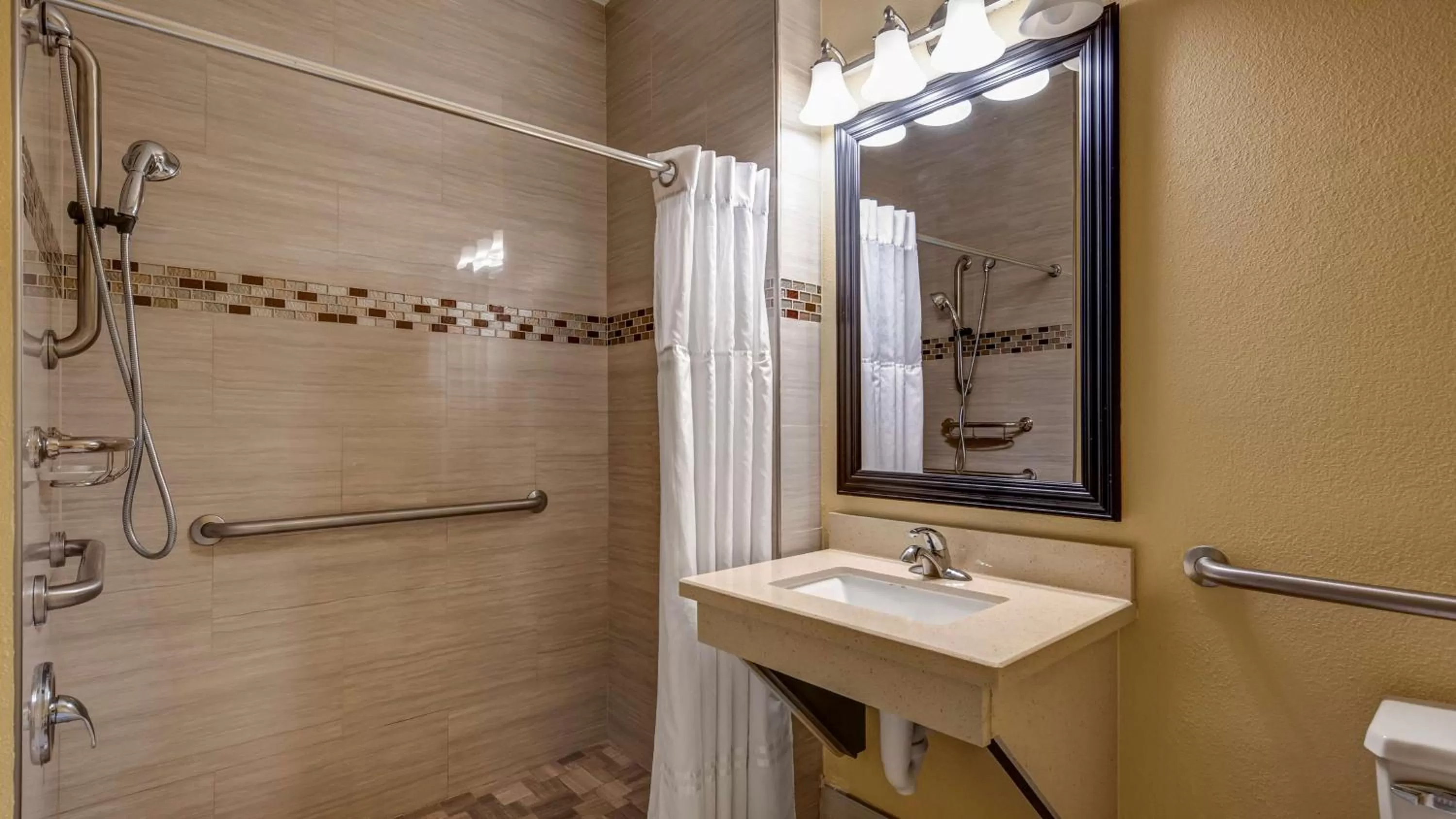 Bathroom in SureStay Plus Hotel by Best Western Alvin