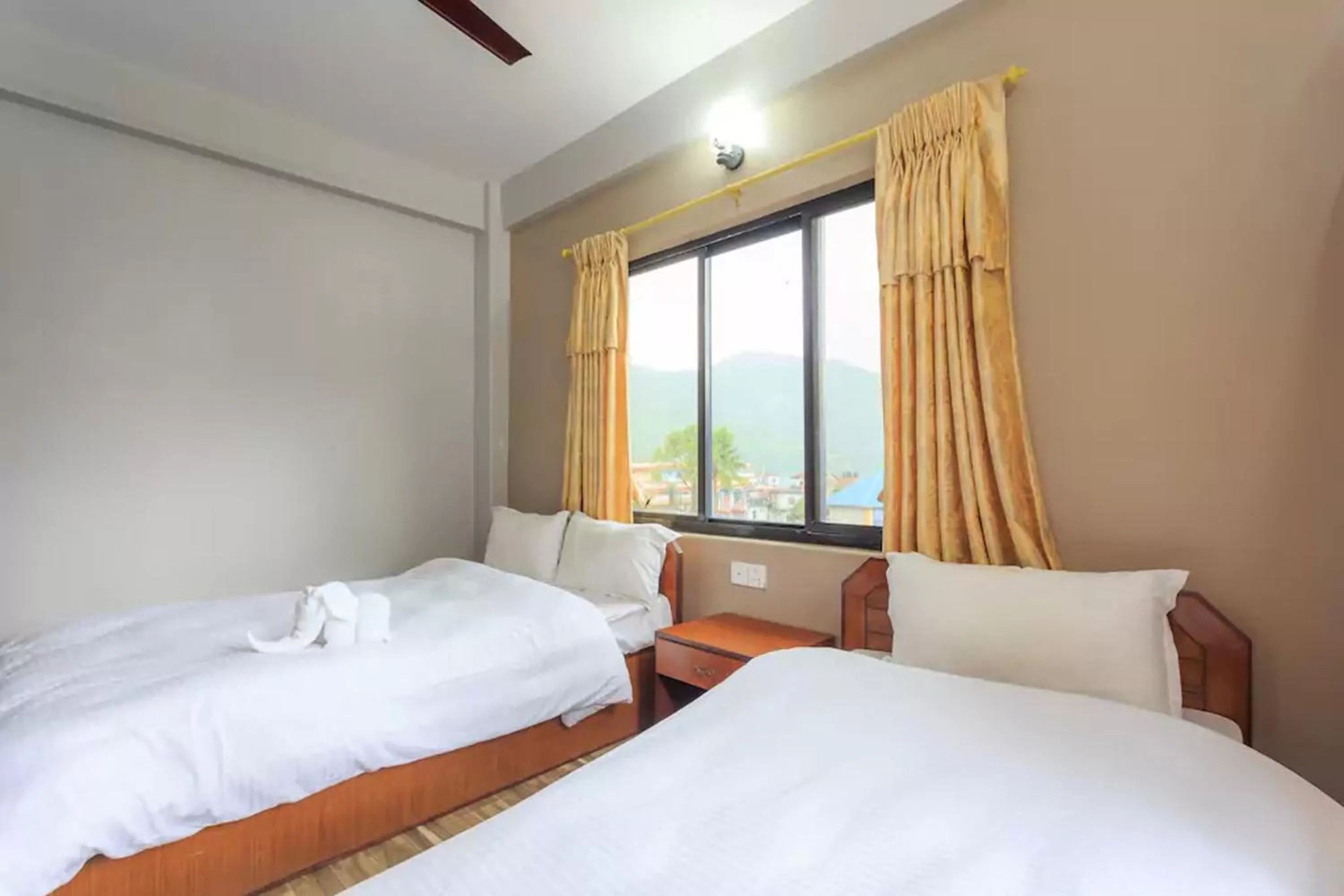 Bed in Hotel Immortal Inn