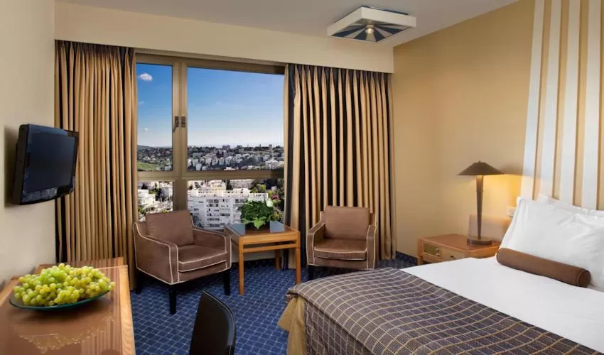 Bed in Dan Panorama Haifa Hotel