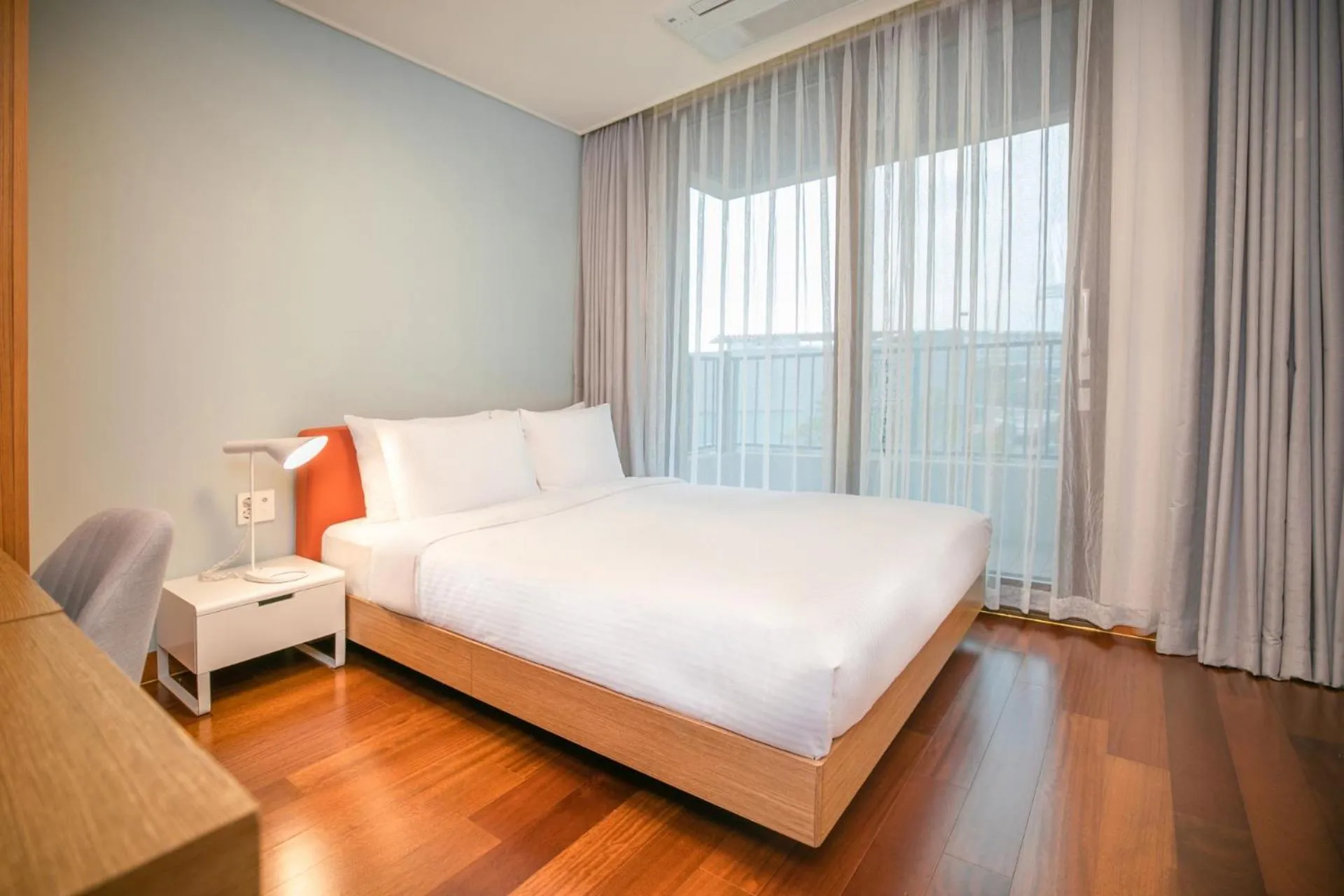 Bed in Somerset Jeju Shinhwa World