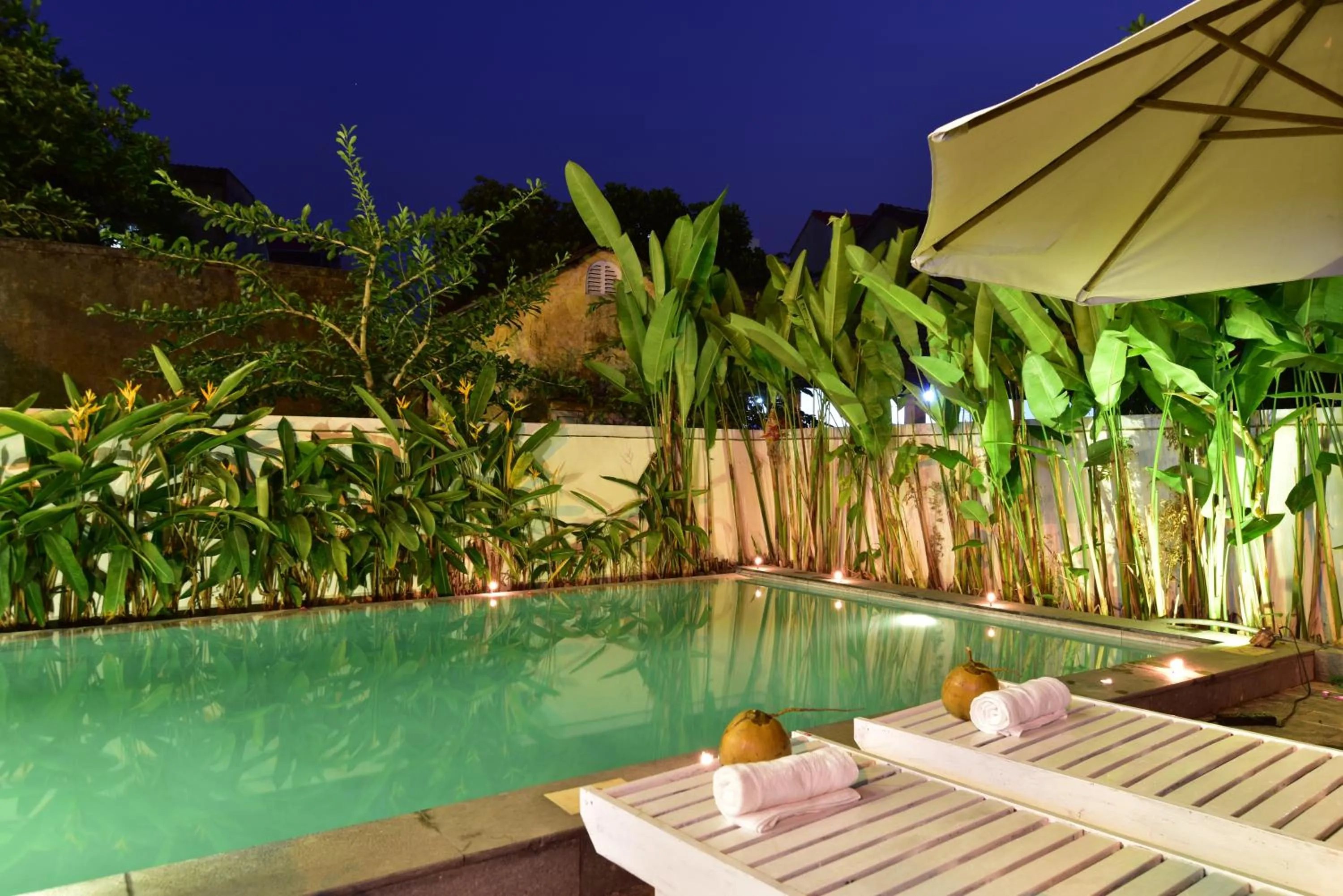 Patio in Flamingo Villa Homestay - Big Rooms with Balcony - Close to Hoi An Old Town 200m & Temple Bridge - Large Outside Pool for Sun Bathing