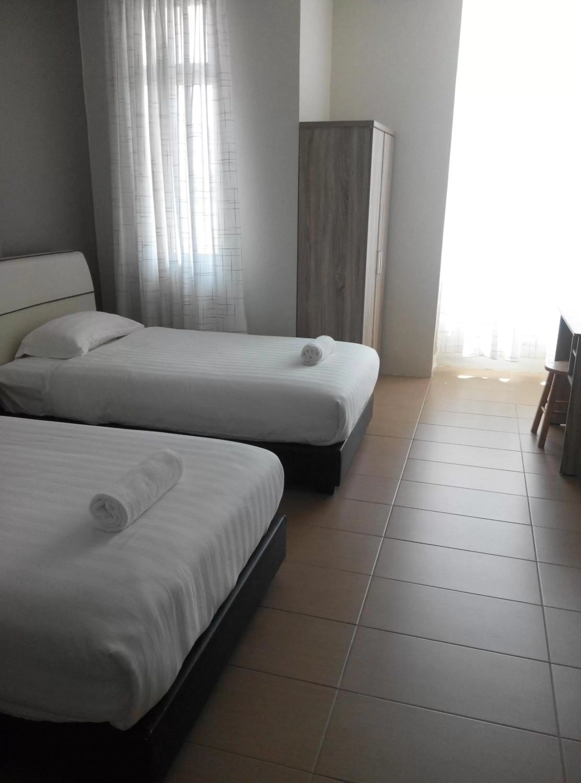 Bed in Welcome Inn GM