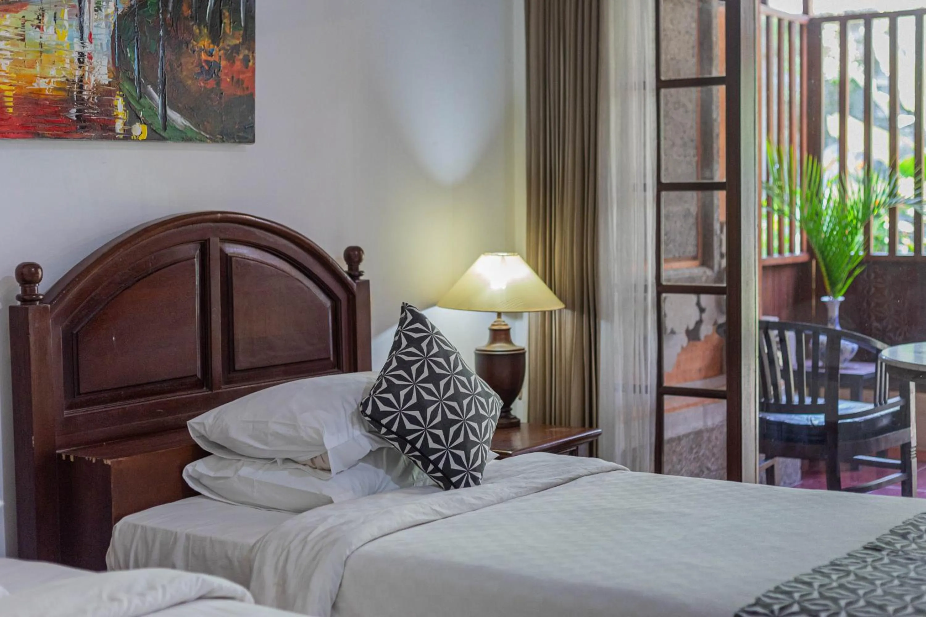 Bed in Puri Mango Guest House Sanur