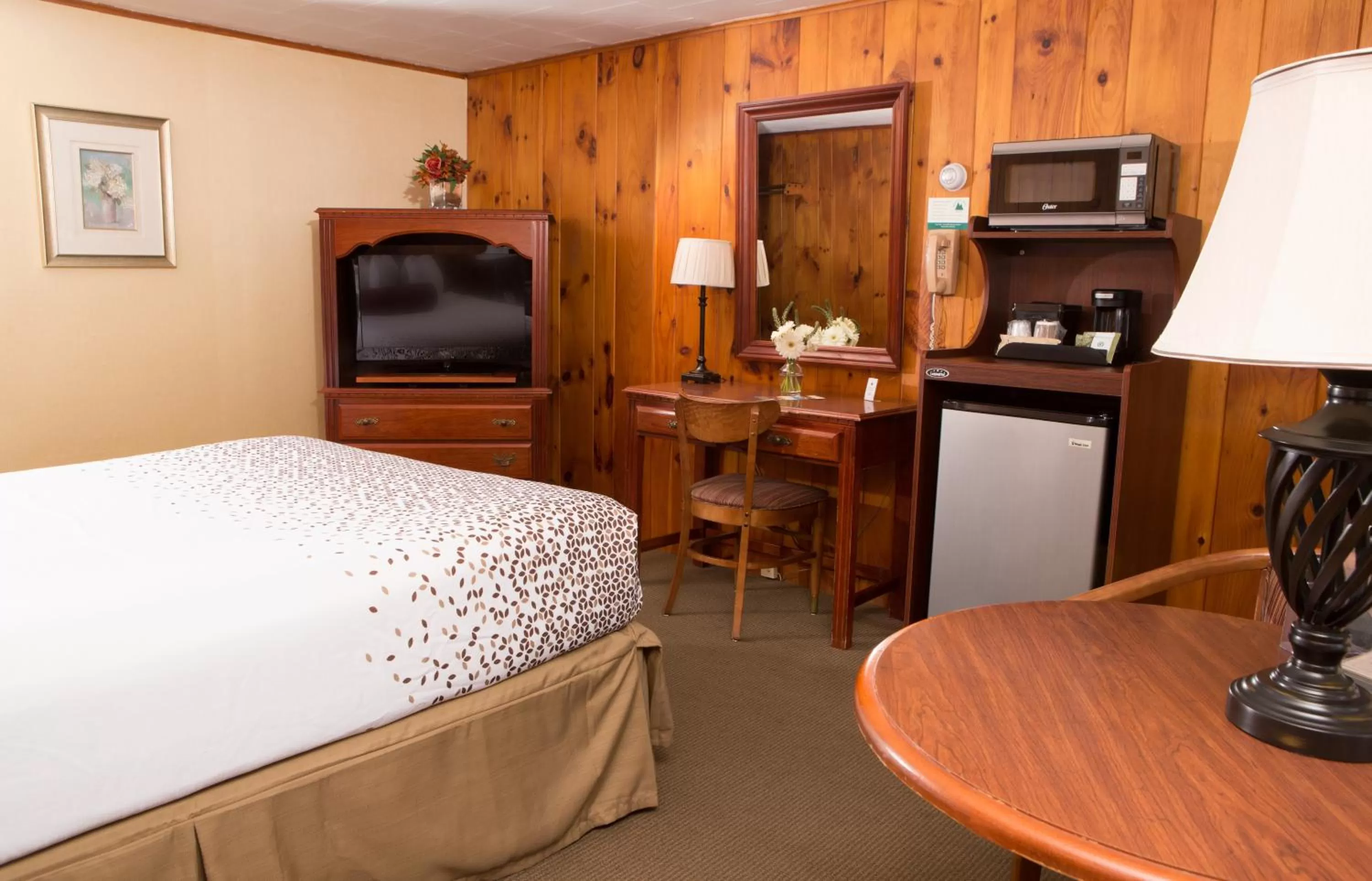 Bed in Knotty Pine Motel