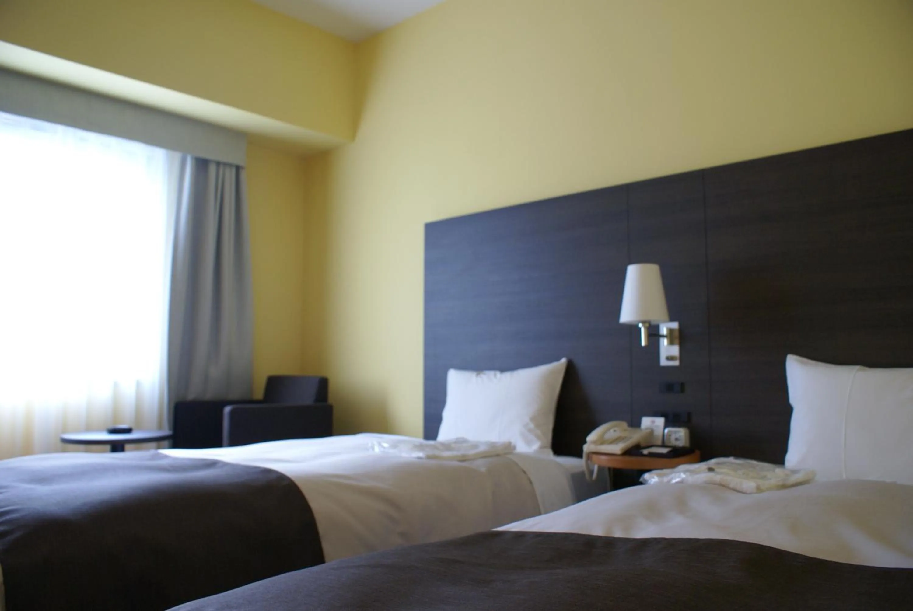 Bed in Ginza Grand Hotel