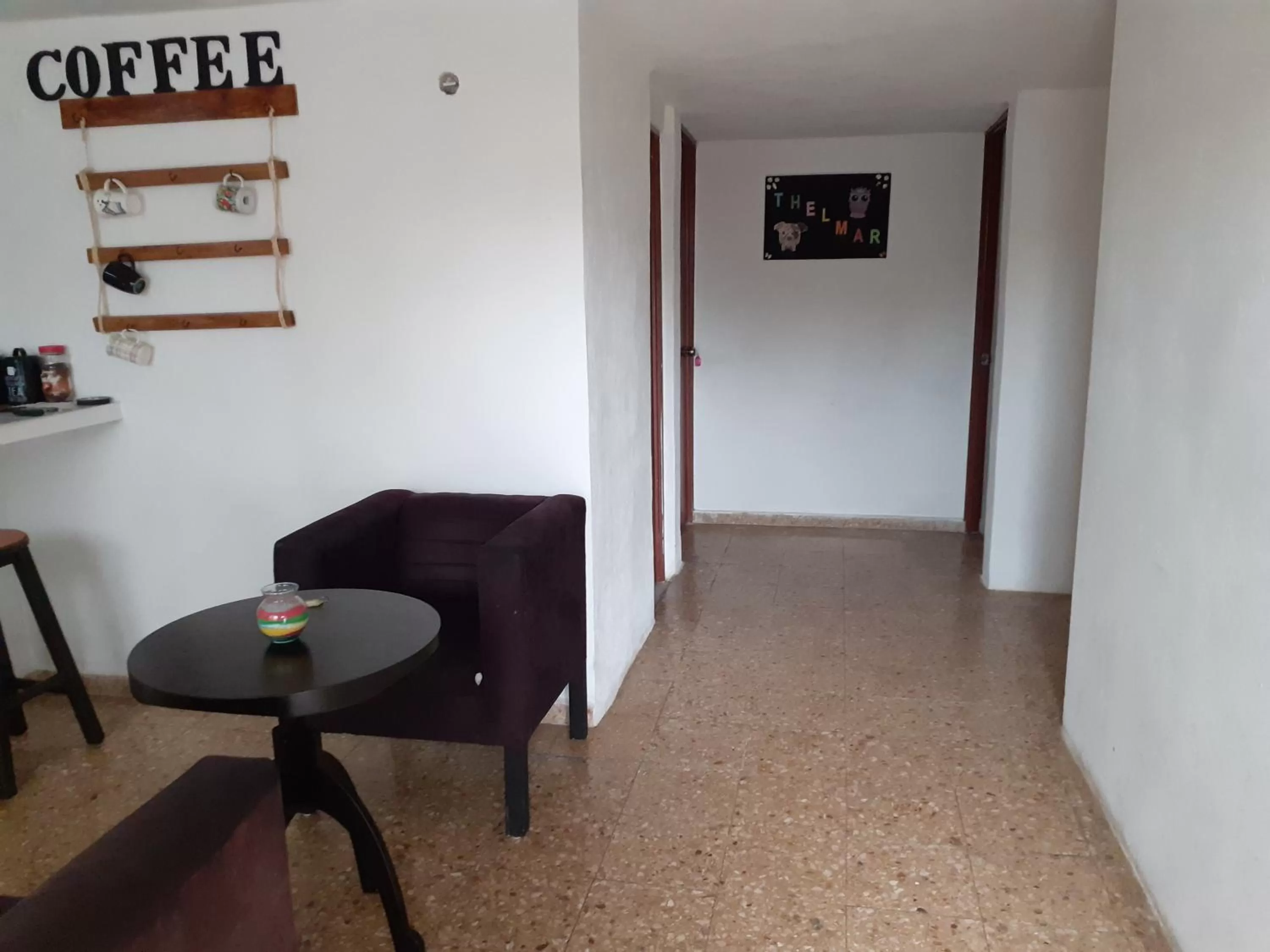 Communal lounge/ TV room in Thelmar Rooms Cancun