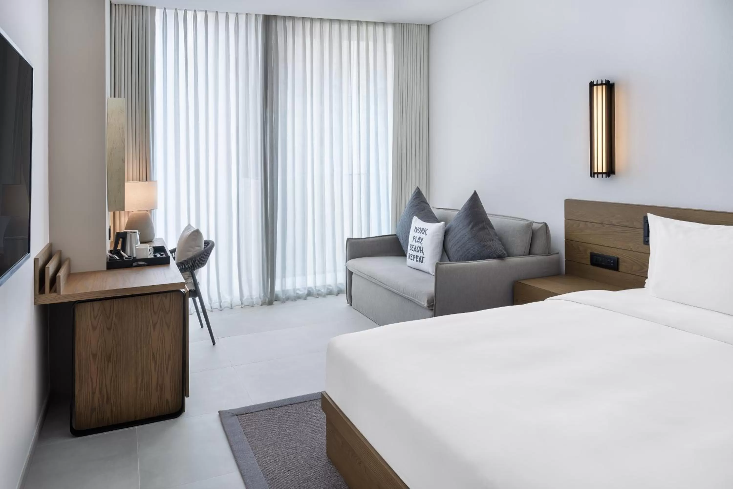 Seating area, Bed in Radisson Beach Resort Palm Jumeirah