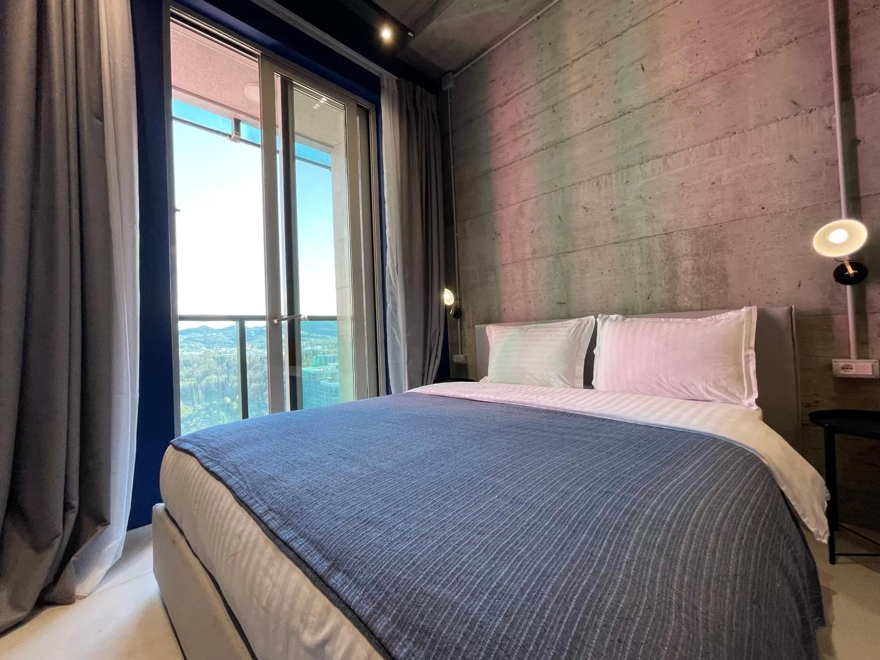 Bed in Ambassador Skyline Apartments