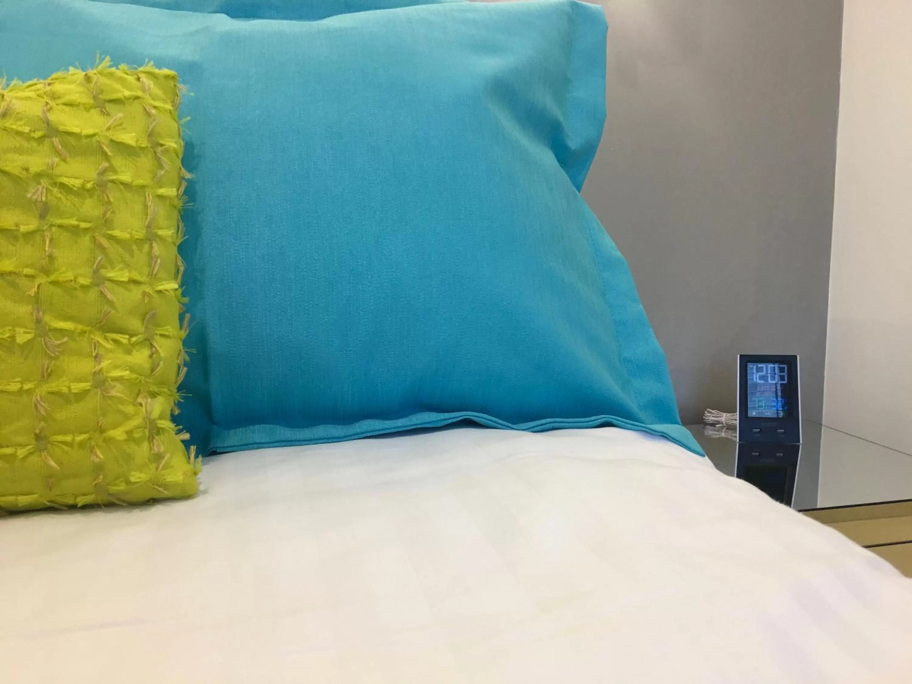 Bed in Herbal Inn Suites