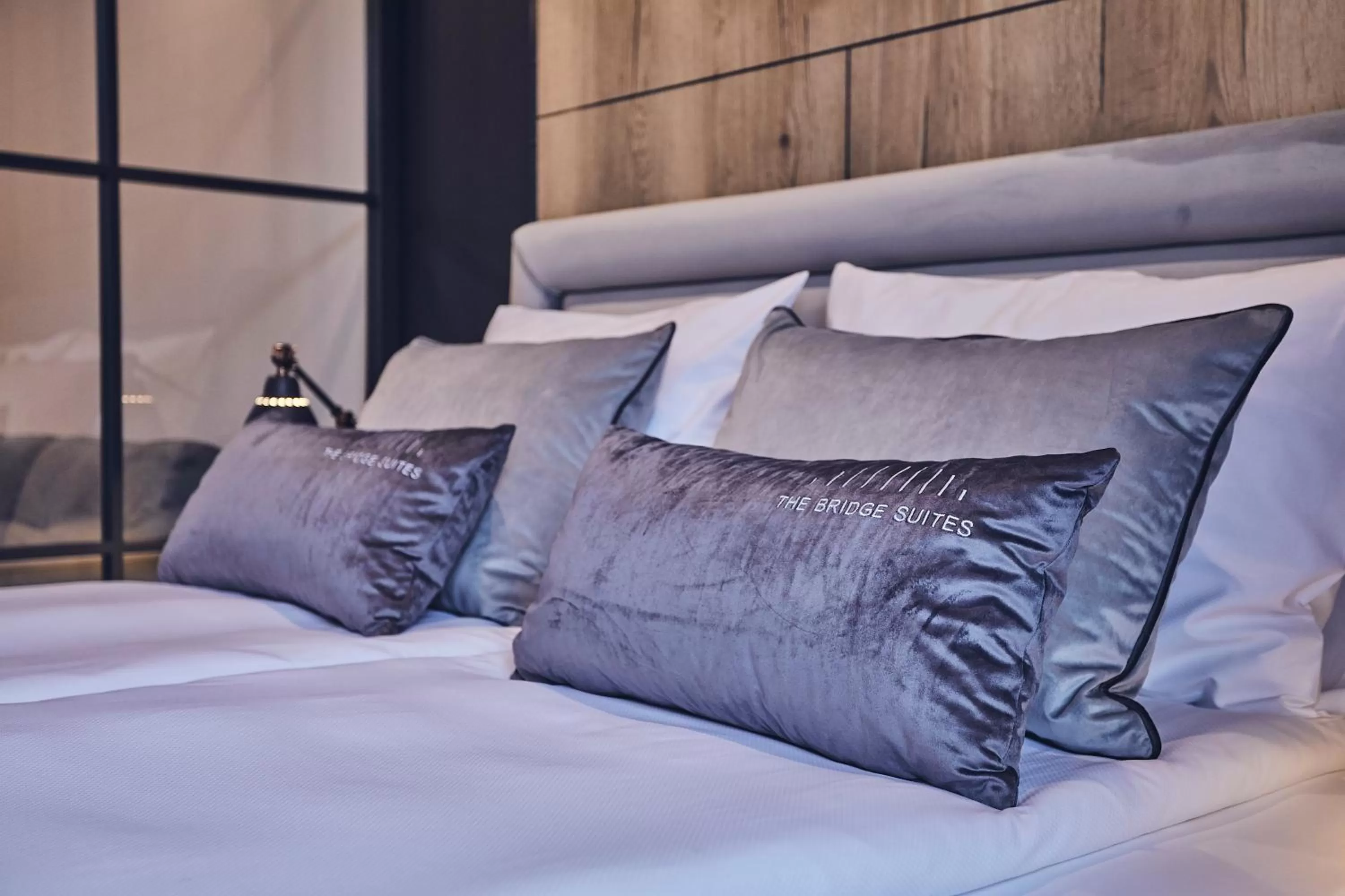 Bed in The Bridge Suites Hotel