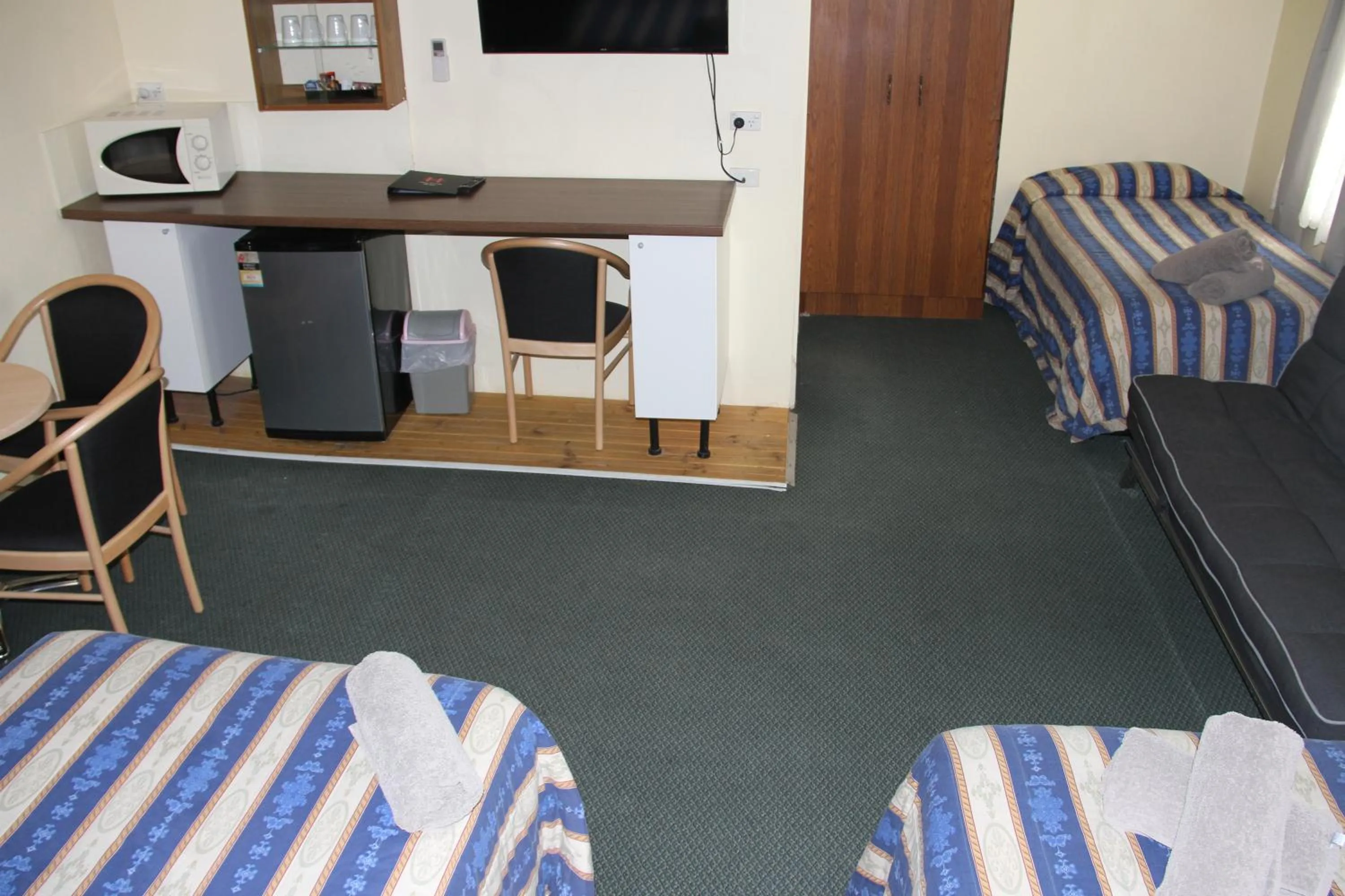 Bed in Alpine Heritage Motel