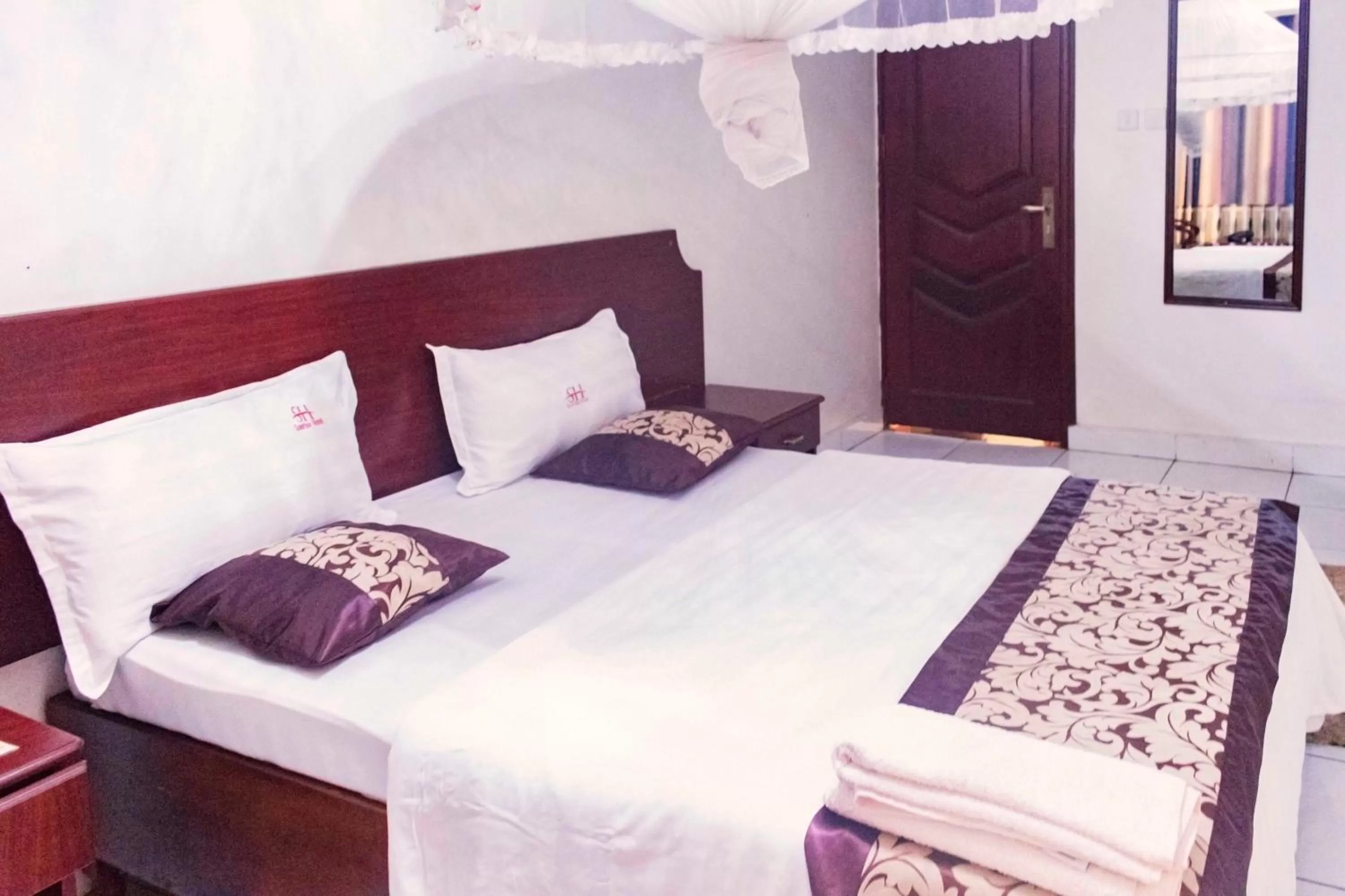 Bed in Sunrise Hotel Kampala