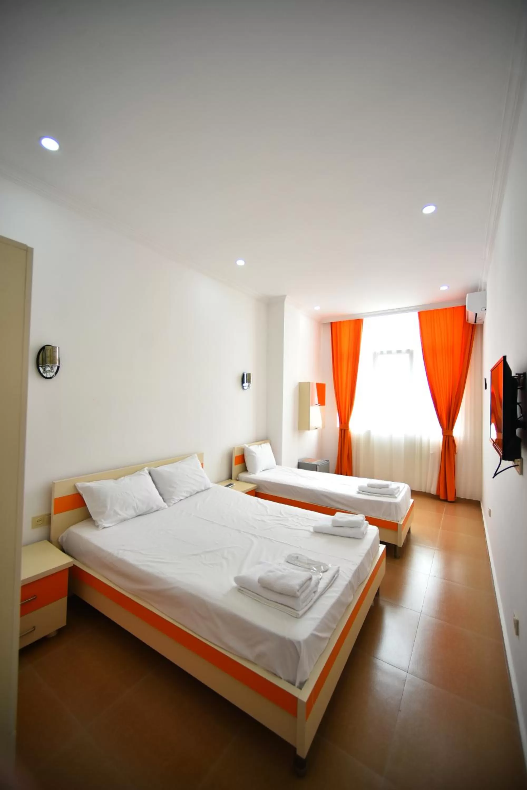 Bed in Orange Home Hotel