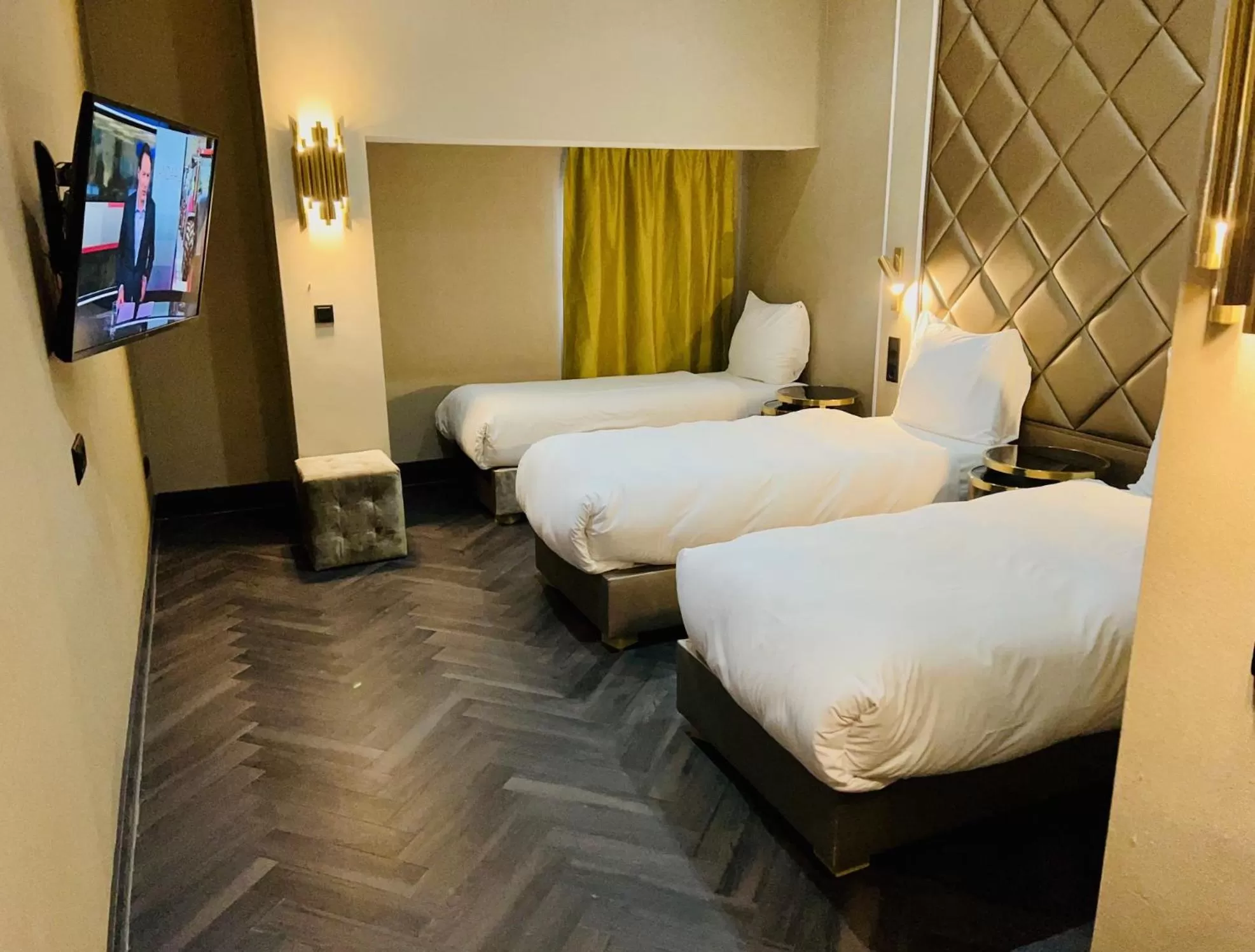 Bed in Triple G Hotels