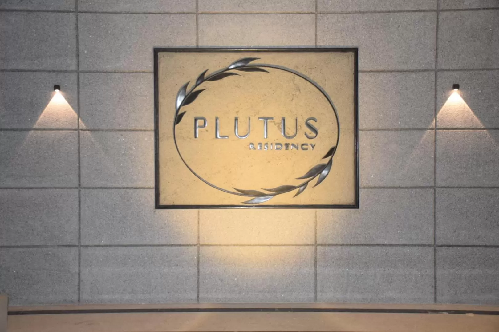 Property logo or sign in PLUTUS RESIDENCY