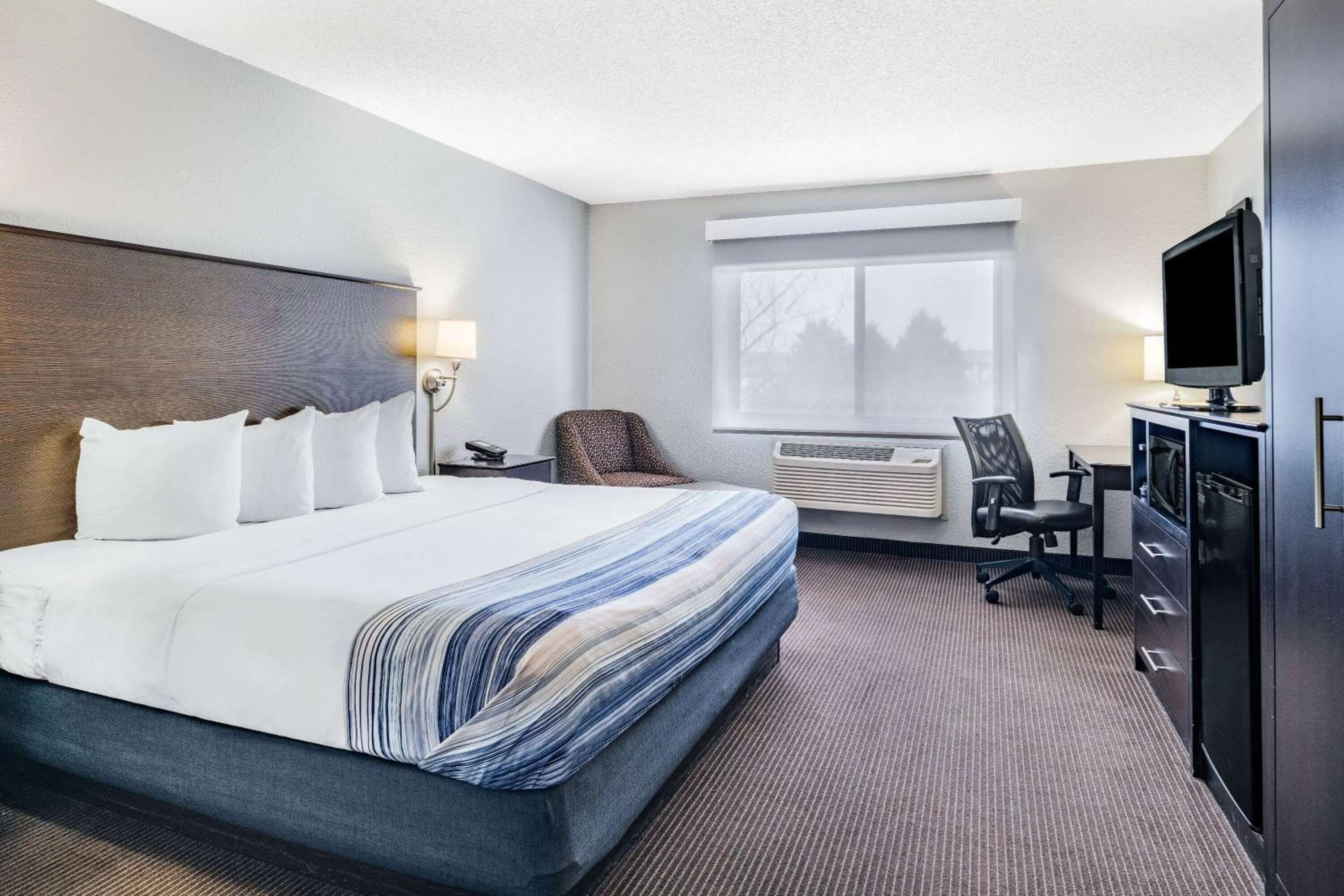 Photo of the whole room, Bed in AmericInn by Wyndham Plover Stevens Point