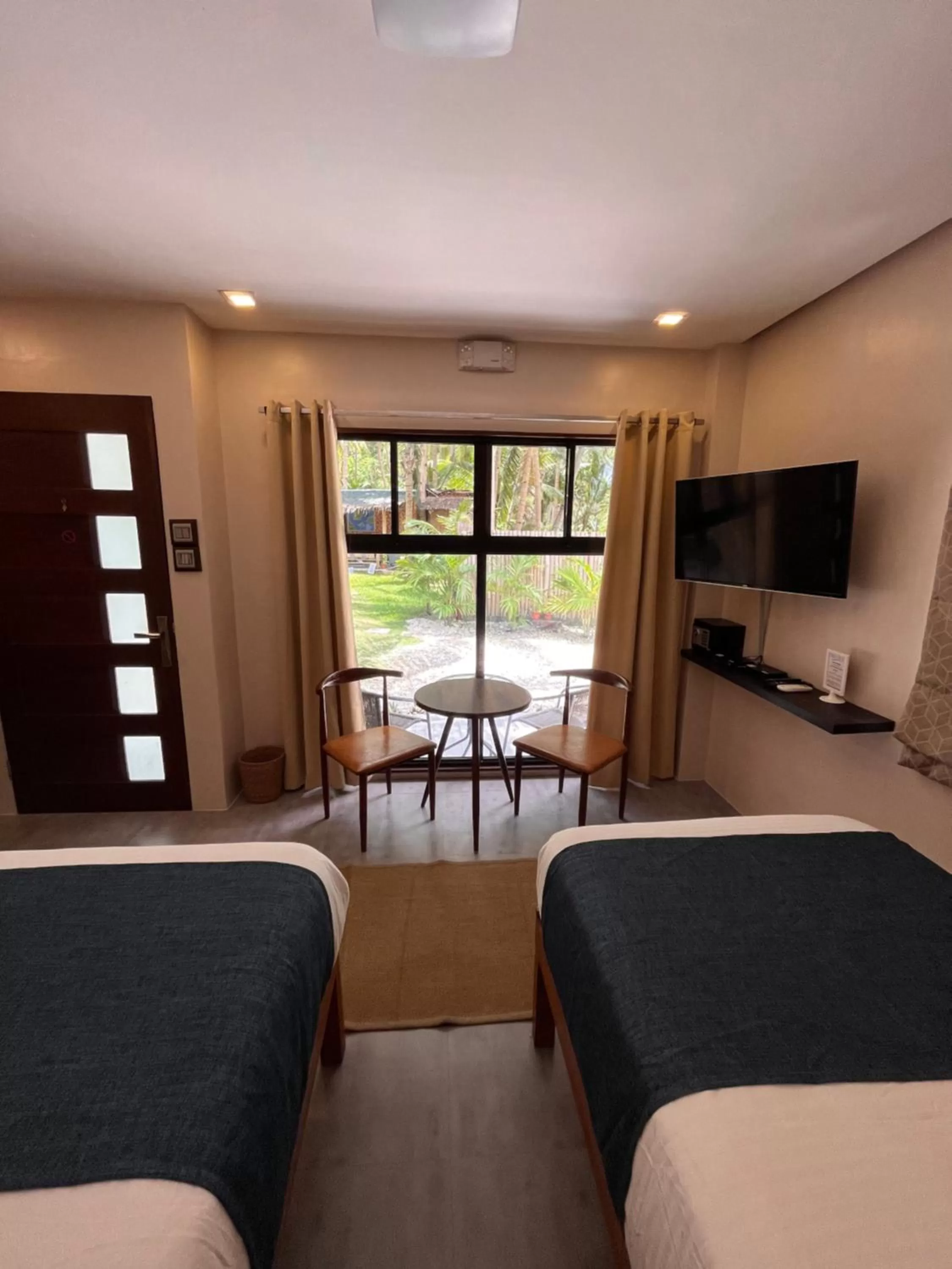 Bed in Southseas Beach Resort and Dive Center