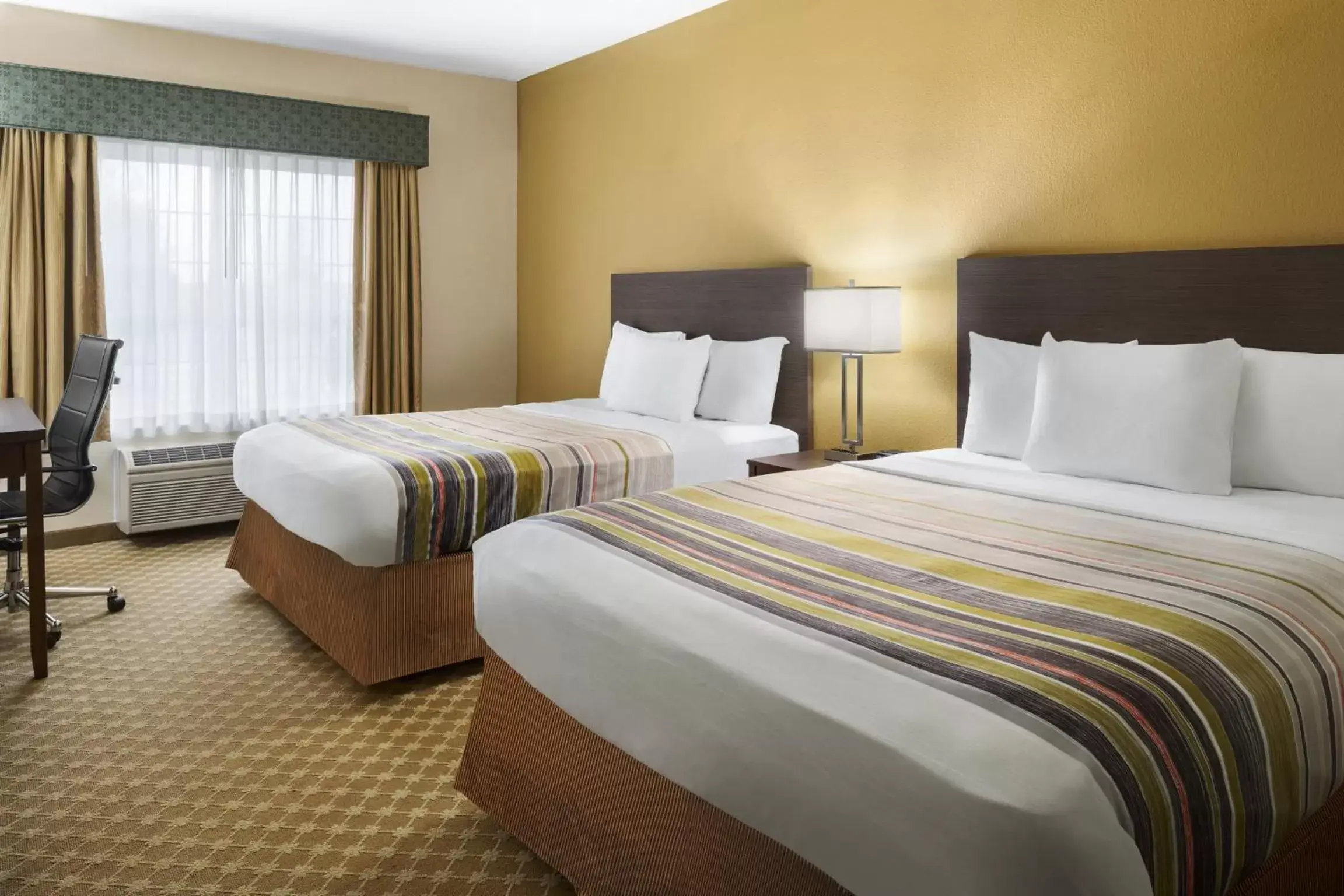 Queen Room with Two Queen Beds in Country Inn & Suites by Radisson, Manteno, IL Queen Room with Two Queen Beds in Country Inn & Suites by Radisson, Manteno, IL