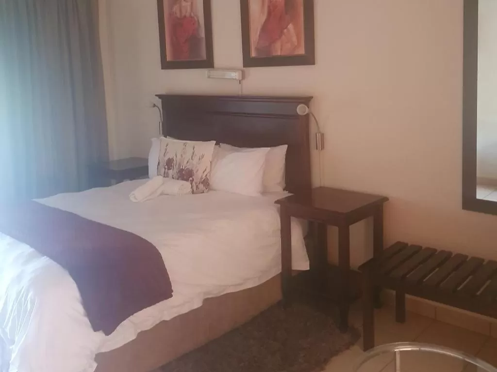 Bed in Mzingeli Guesthouse