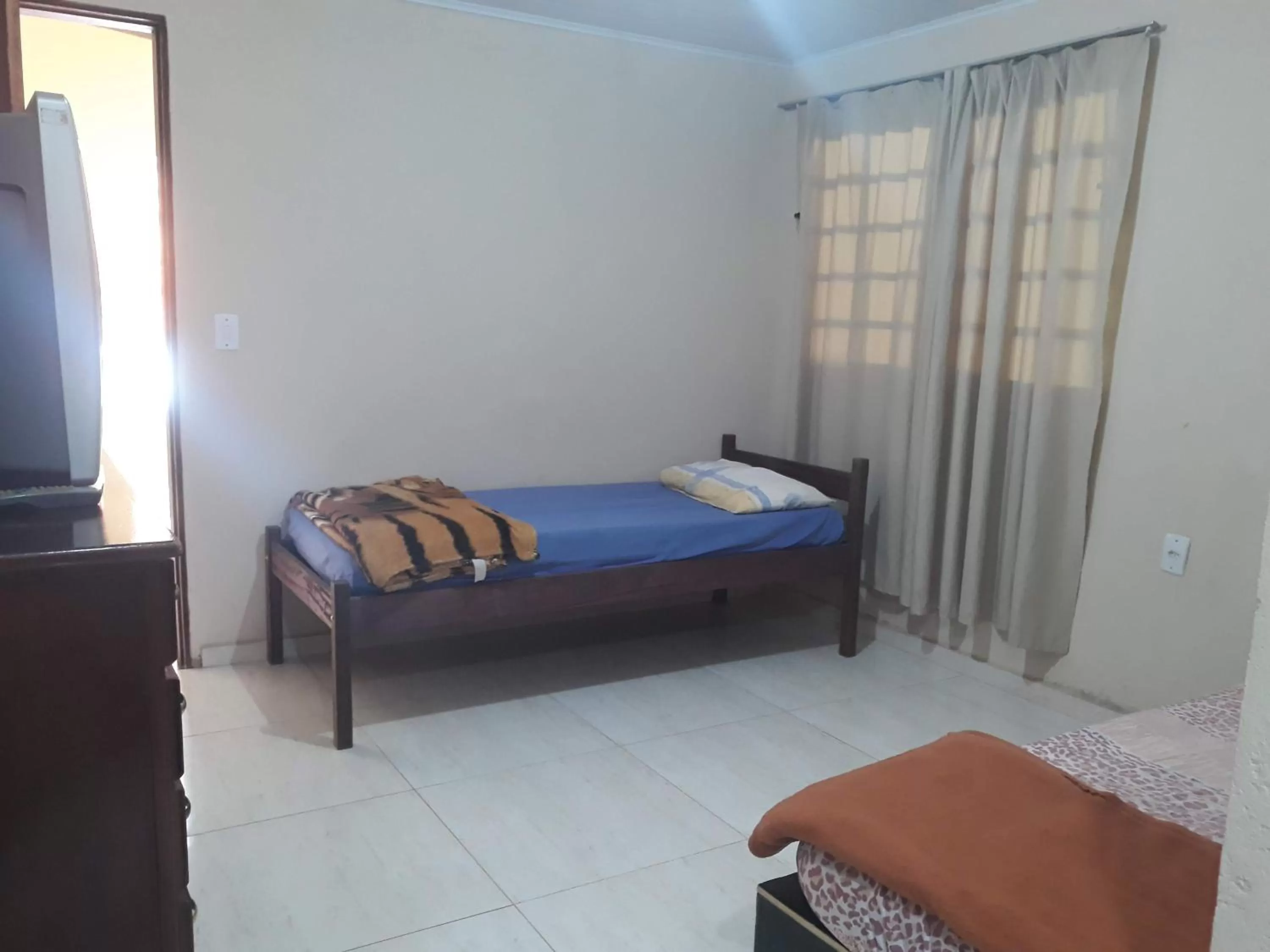 Bed in Pousada do Ribeirão