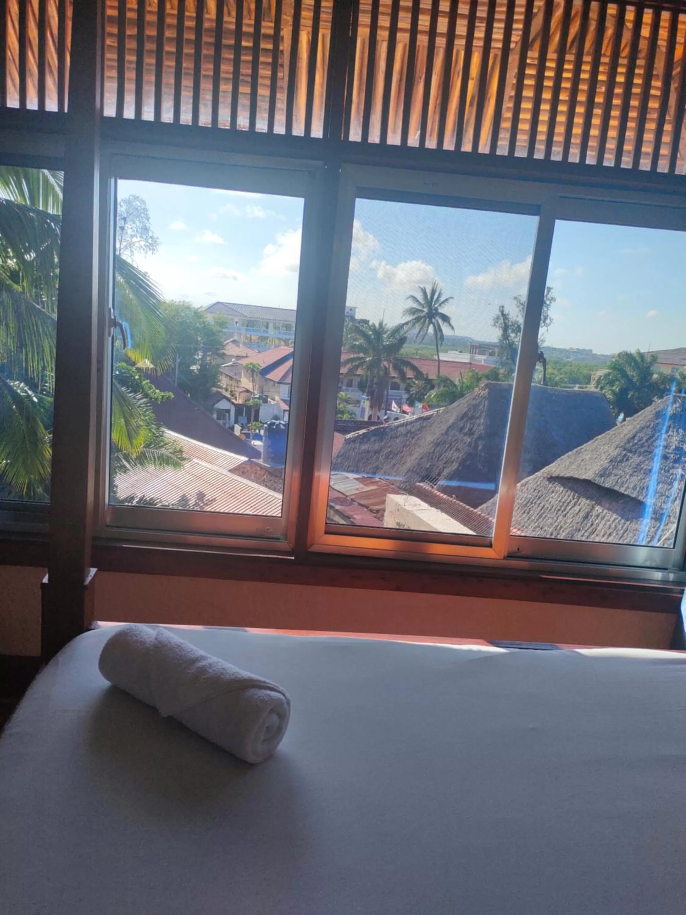 Bed, Mountain View in Serene Beach Resort
