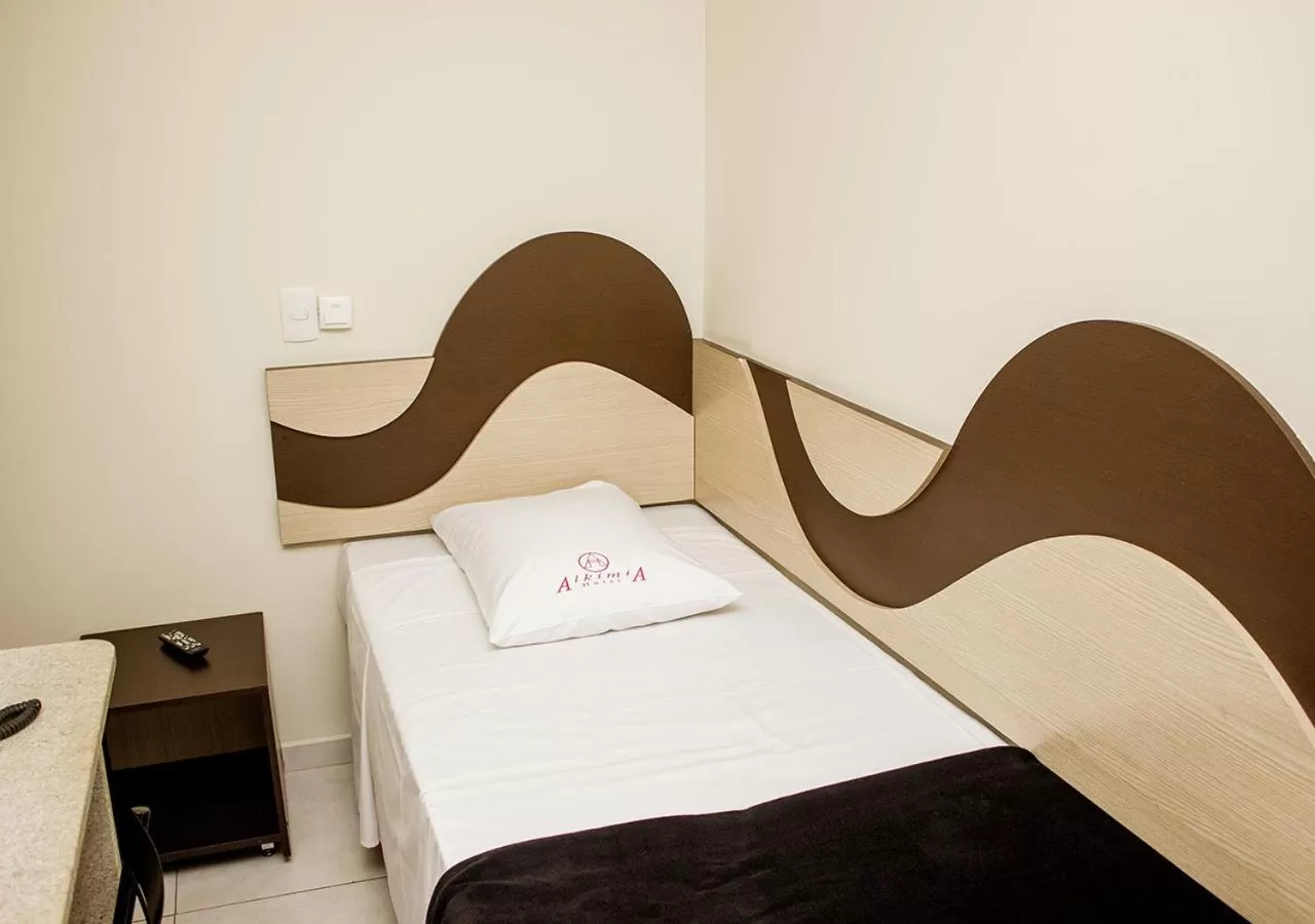 Bed in Alkimia Hotel