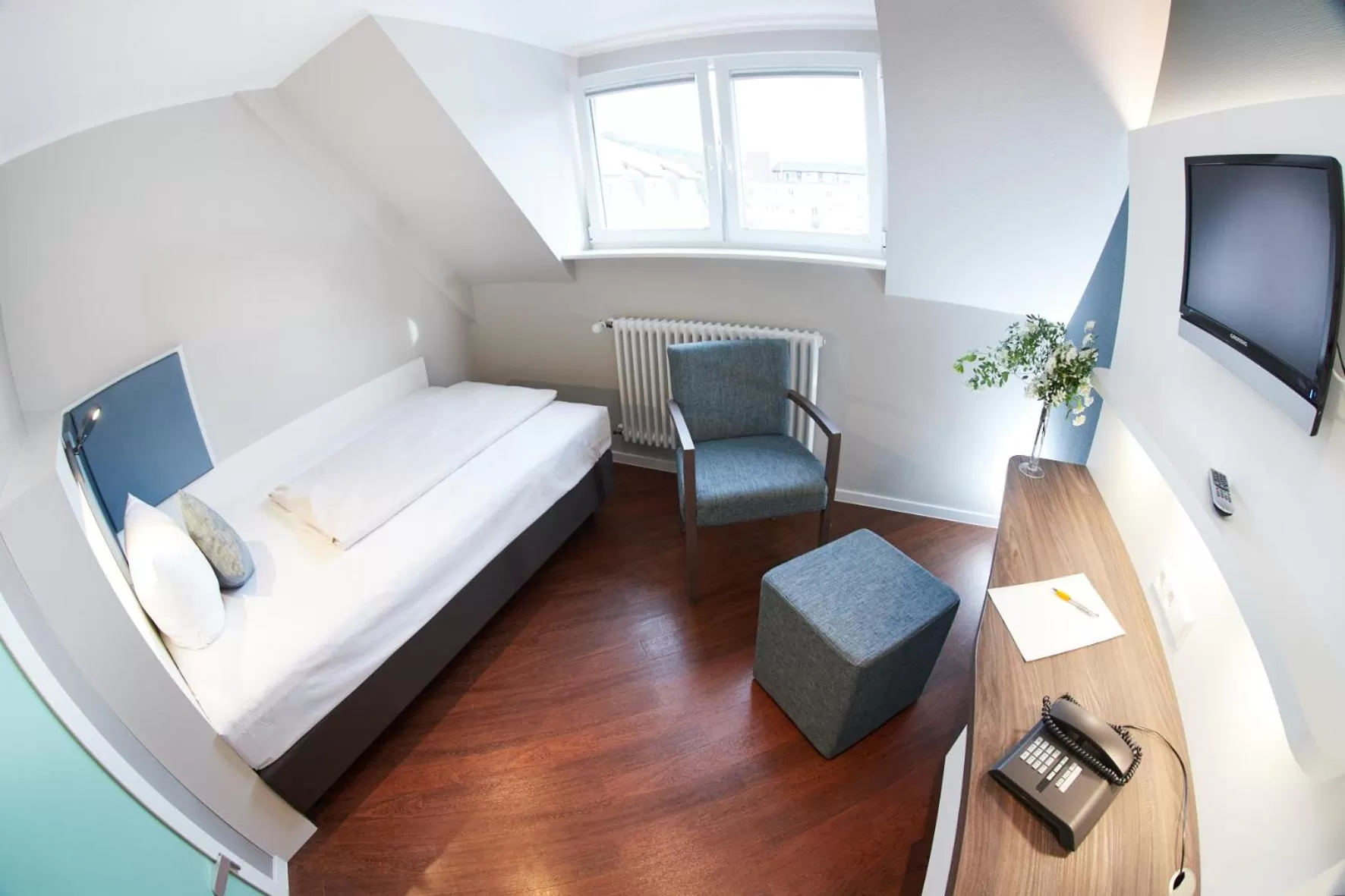 Photo of the whole room, Bed in Stadthotel Freiburg Kolping Hotels & Resorts