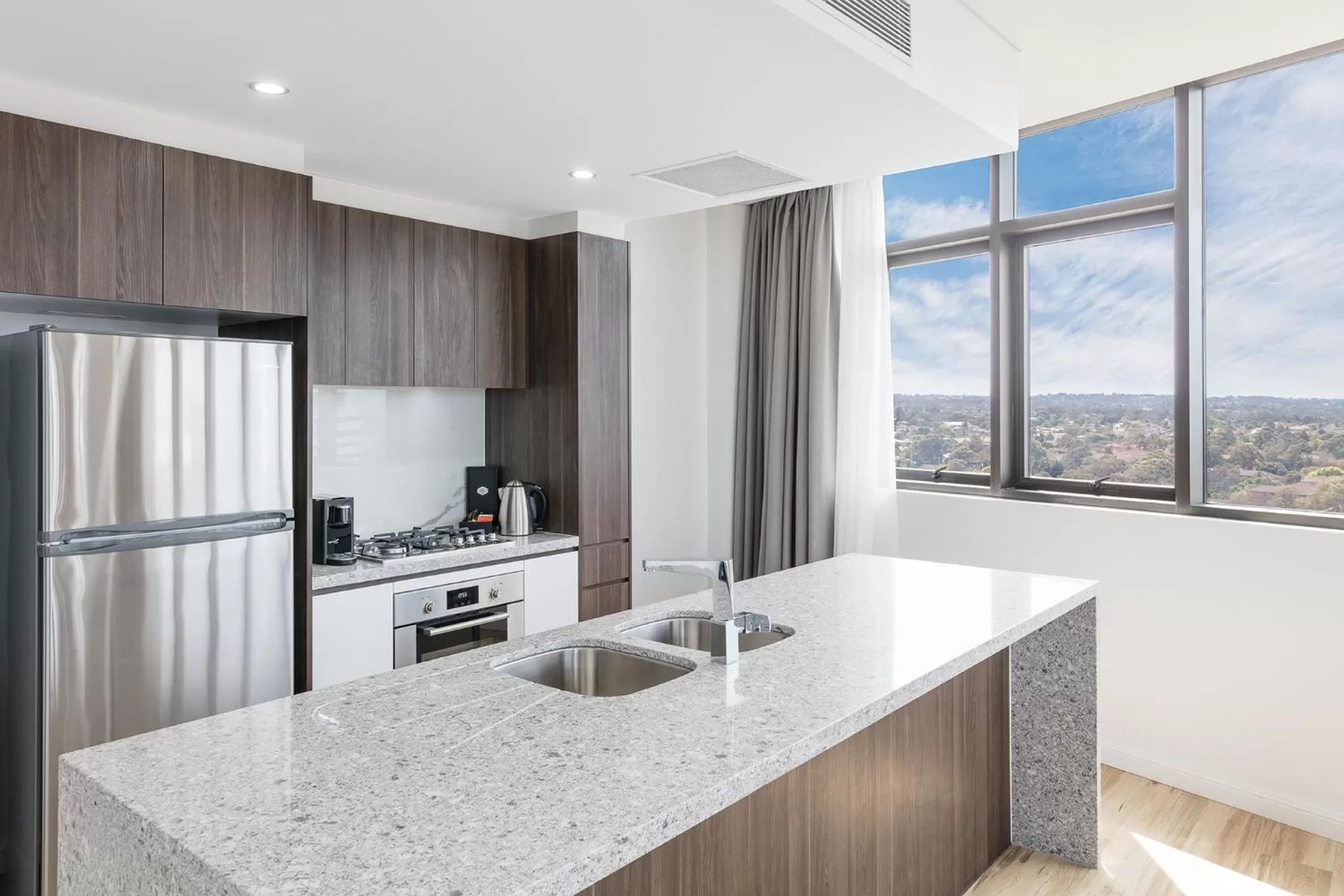 Kitchen or kitchenette in Meriton Suites Church Street, Parramatta