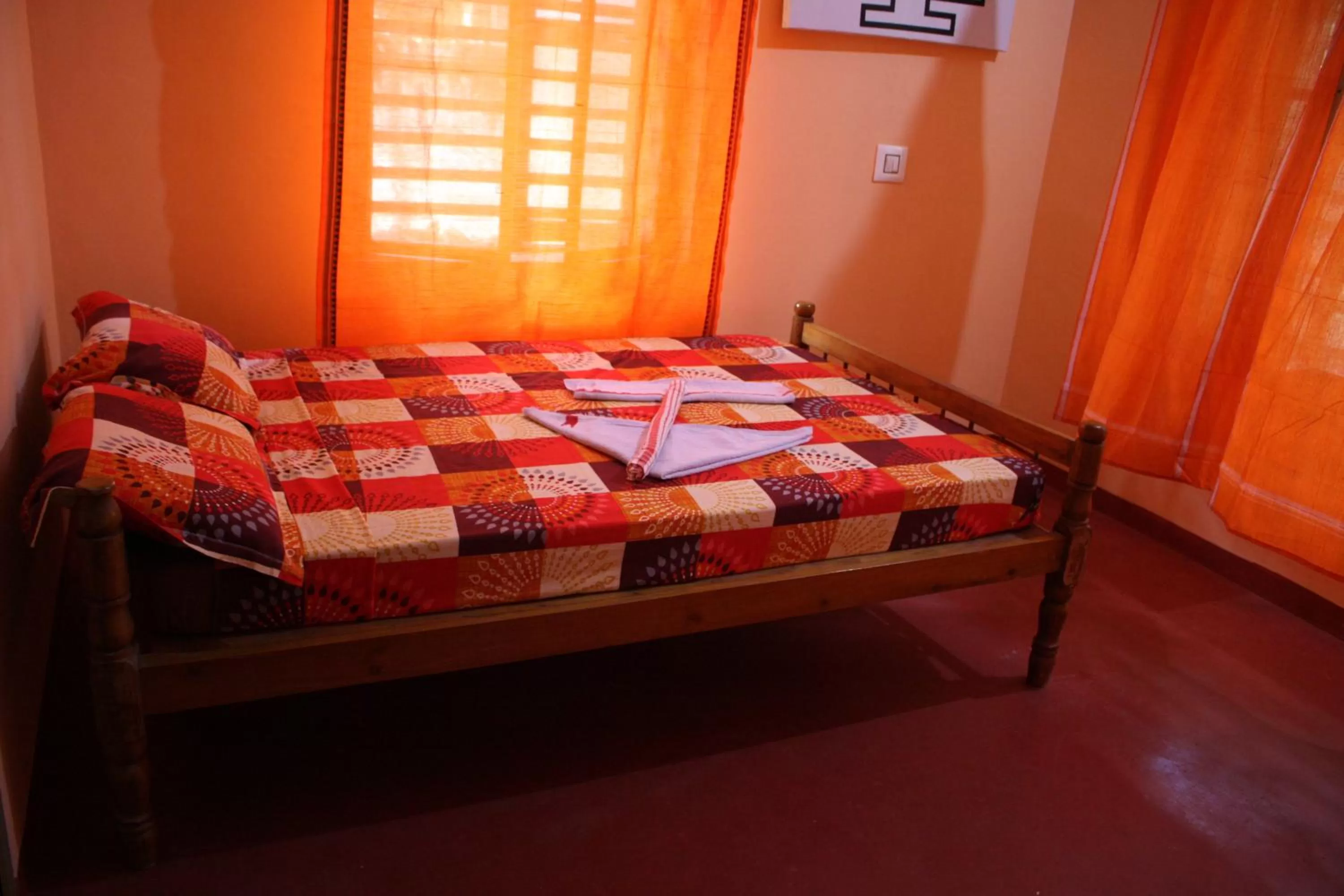 Bed in Sukriti beach Resort