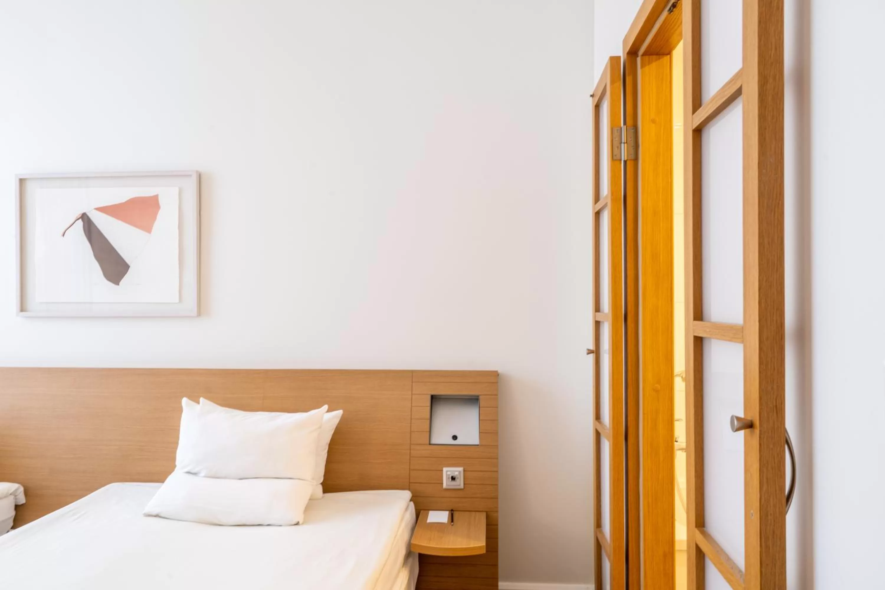 Property building, Bed in Novotel Vilnius Centre