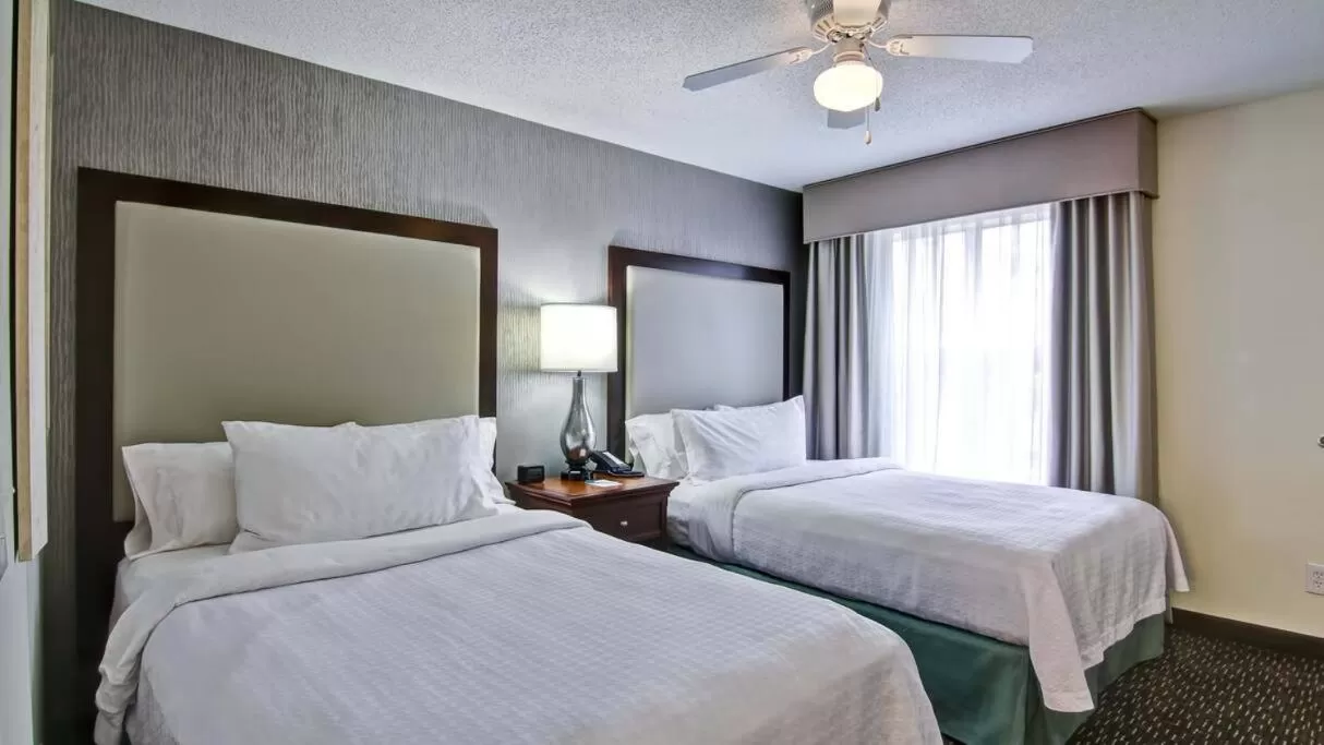 Bed in Poplar Inn and Suites