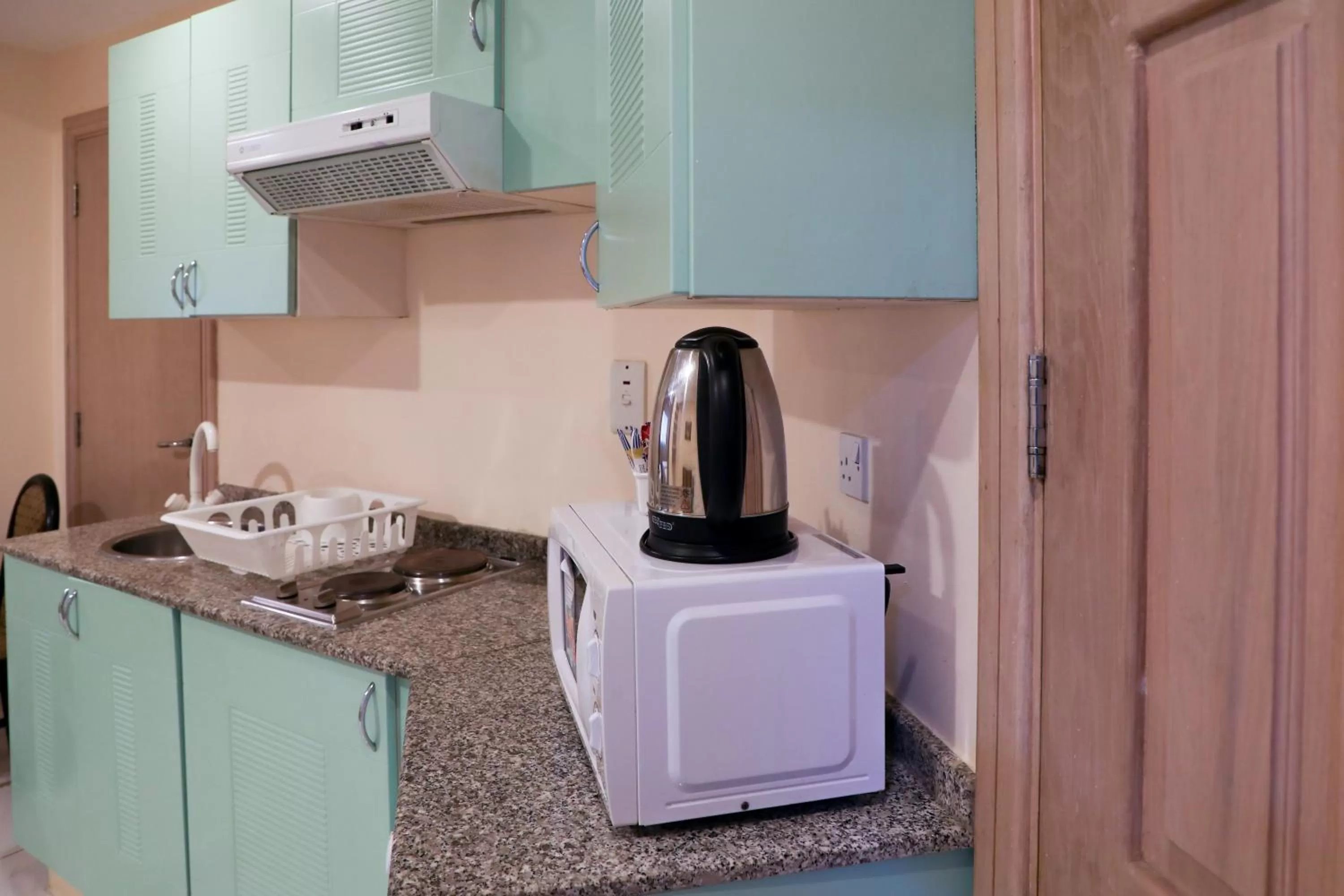 kitchen in West Zone Pearl Hotel Apartment