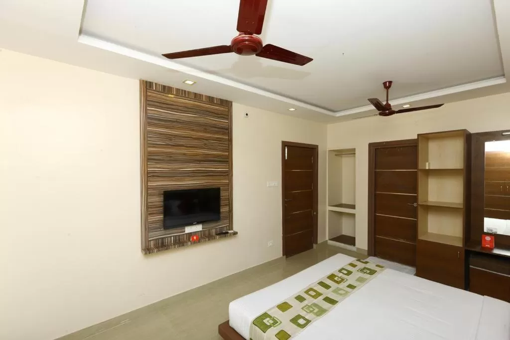 Photo of the whole room, Bed in Sri Kamadhenu Residency