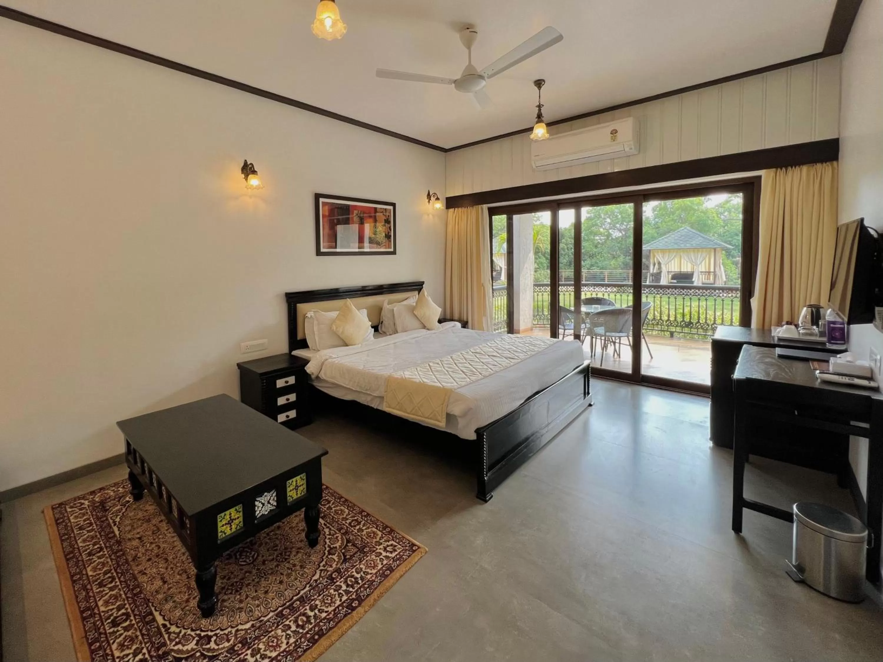 Communal lounge/ TV room, Bed in Tranquil Resort & Spa