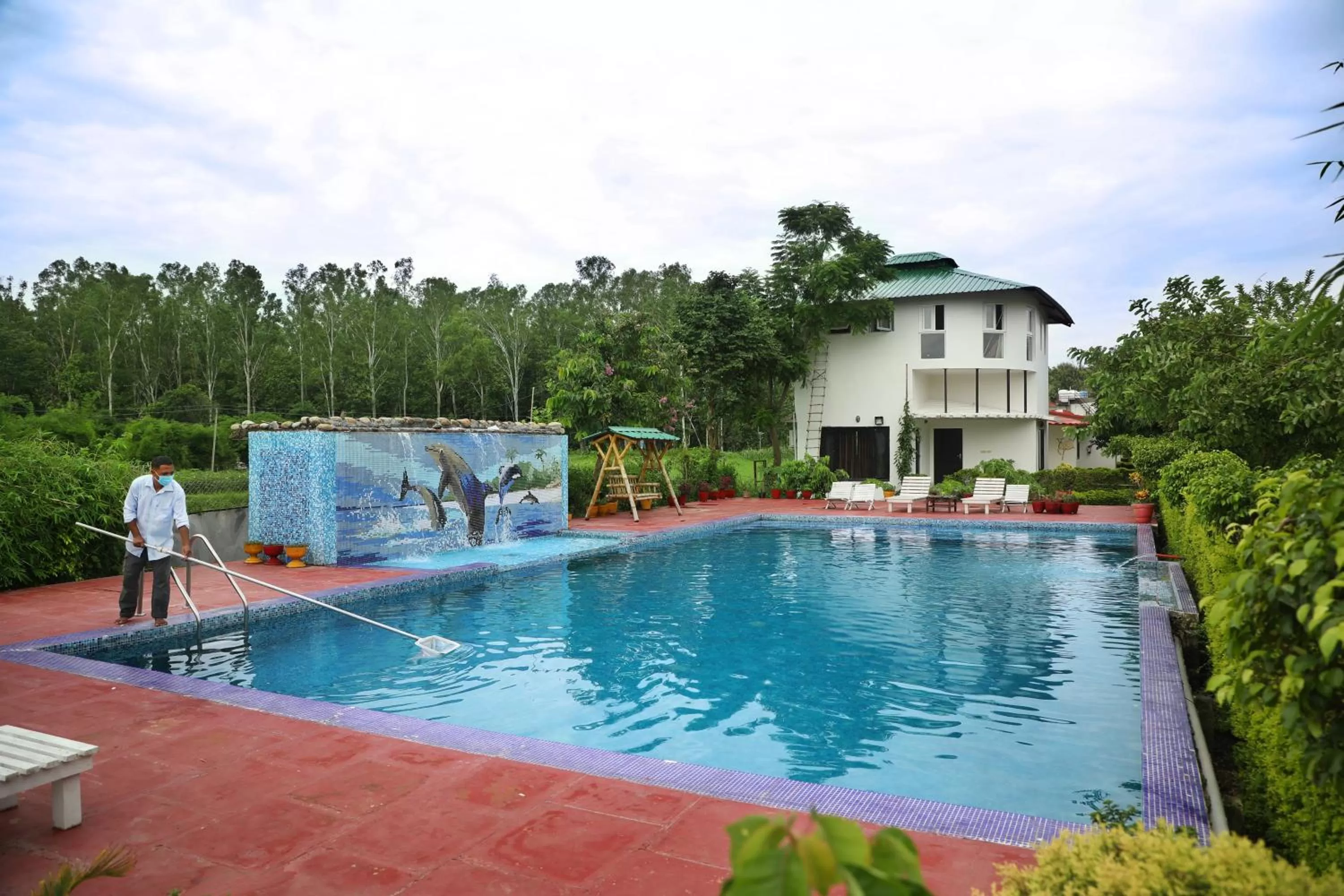 Swimming pool in Corbett Treat Resort By Atya Hotels