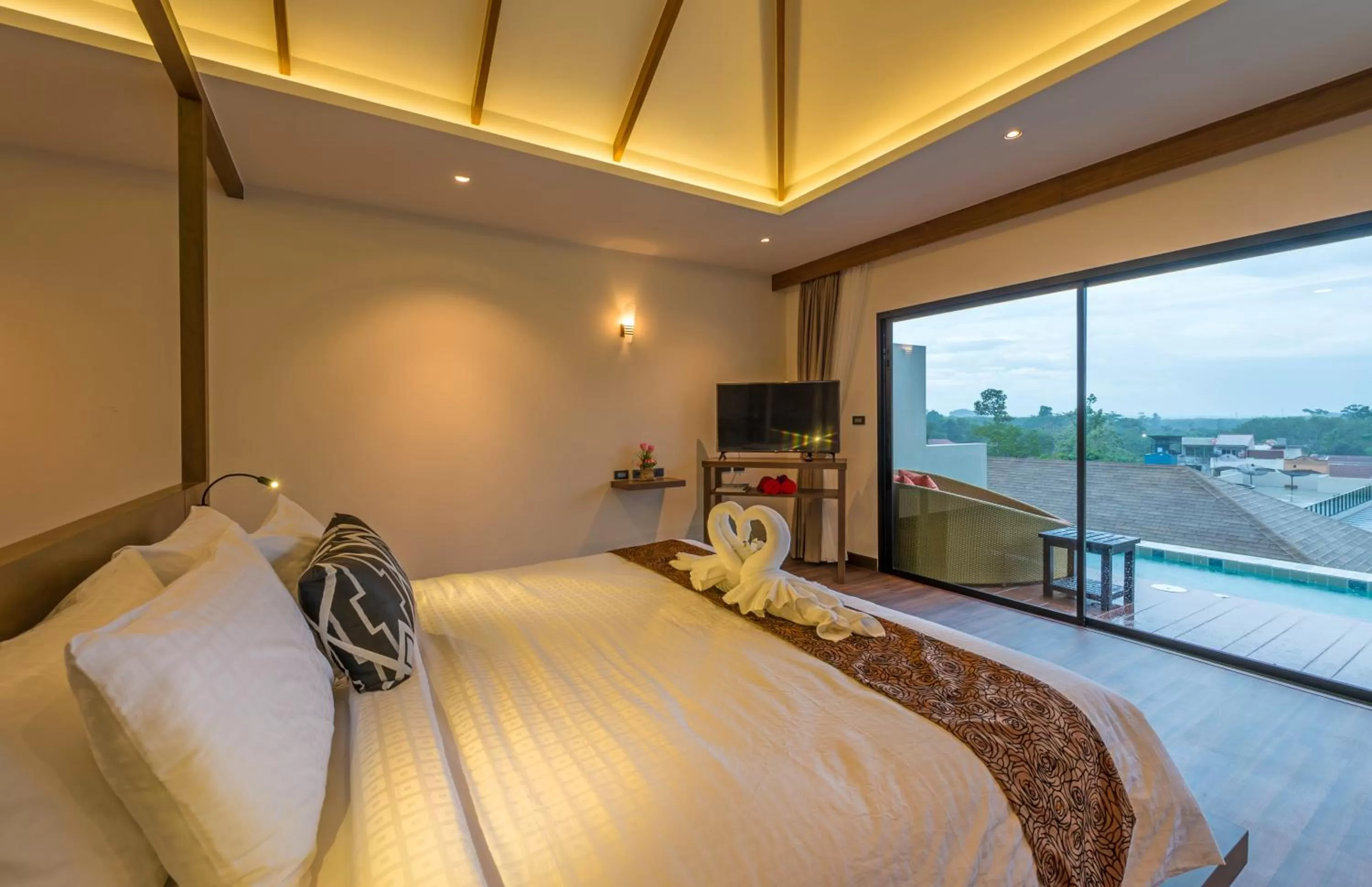 Bed in Cher​mantra​ Aonang​ Resort & Pool​ Suite