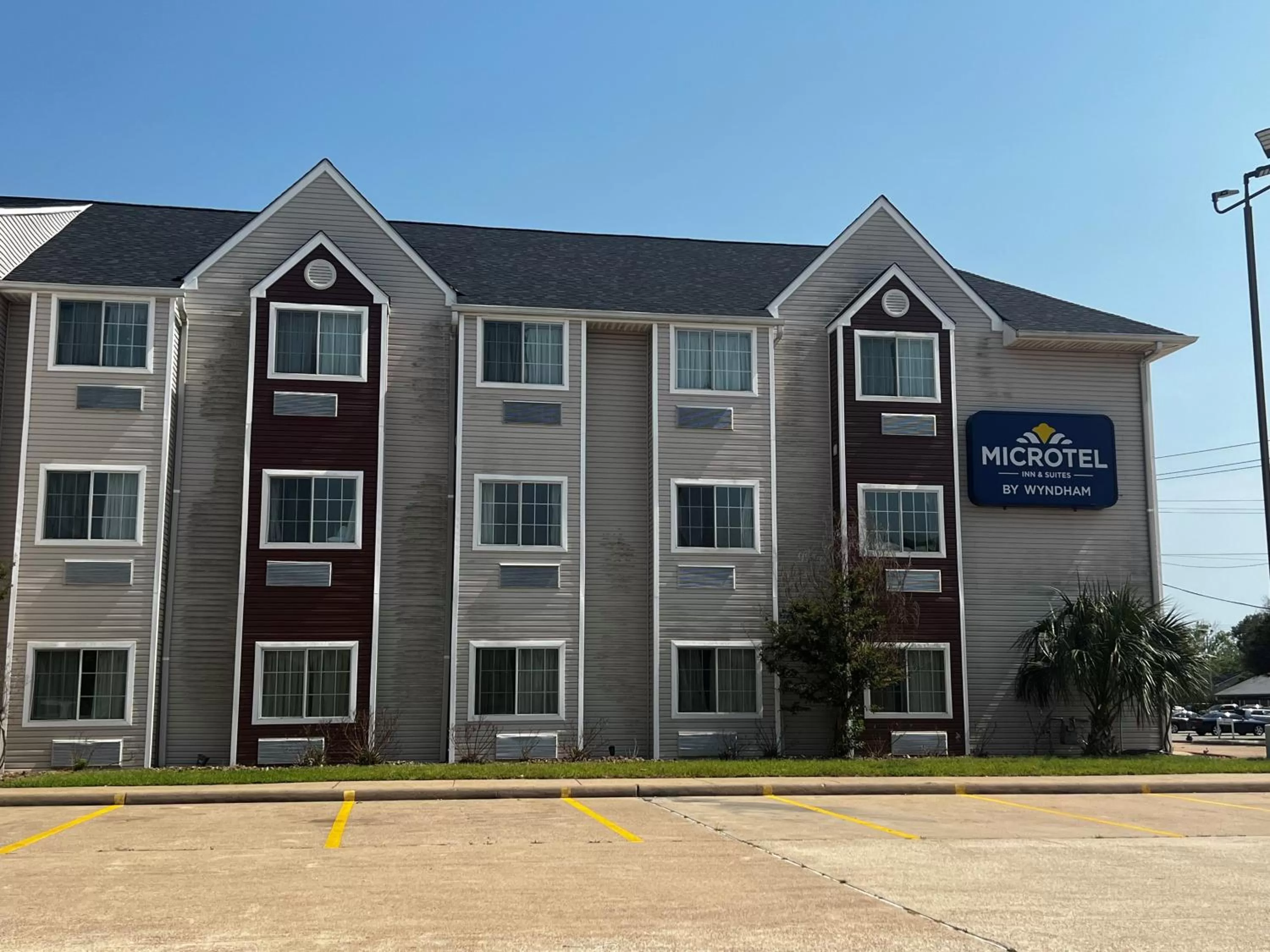 Property logo or sign in Microtel Inn & Suites by Wyndham Houston/Webster/Nasa/Clearlake