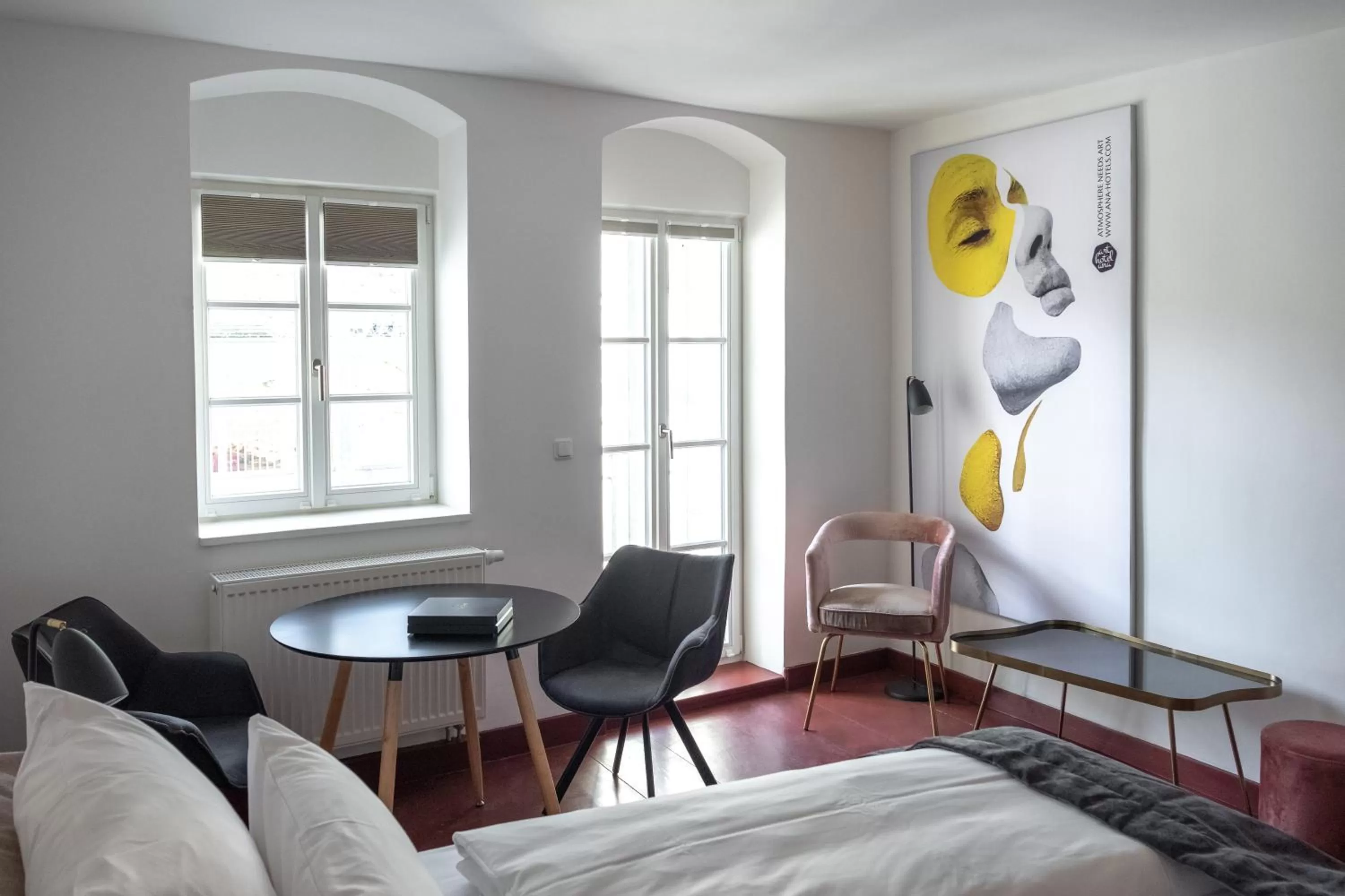 Seating area, Bed in ANA Living Augsburg City Center by Arthotel ANA - Self-Service-Hotel