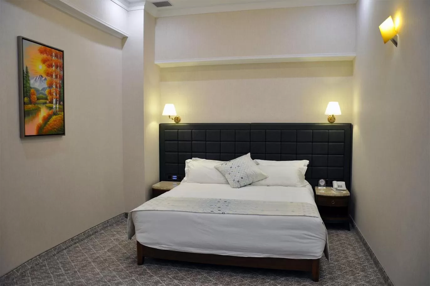 Bed in Parliament Palace Hotel